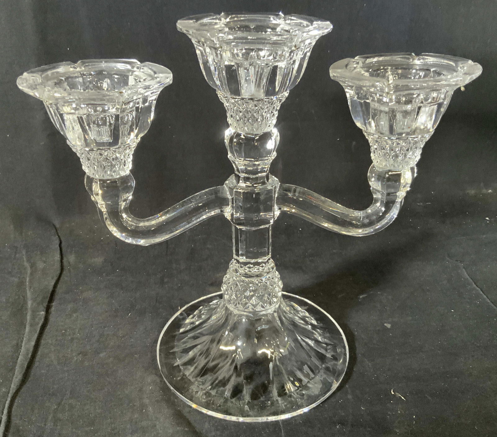 Antique Crystal 3 Arm Candelabra: Vintage possibly antique three arm glass/ crystal candelabra, centerpiece table ware, decorative accessory, three scrolled arms with wide walled faceted flared candle holder cups, faceted center stem