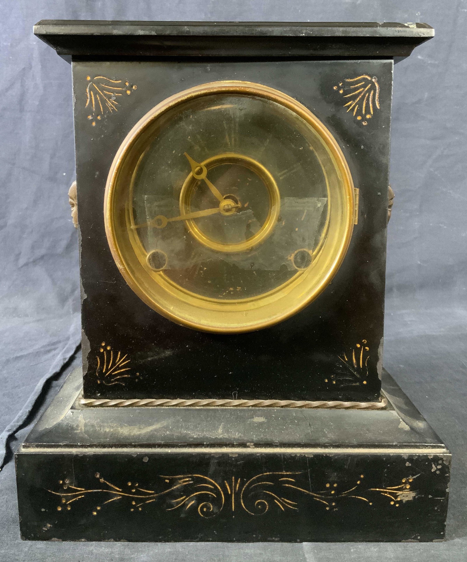 Vintage Slate & Cast Iron Mantel Clock: Vintage Slate & Cast Iron Mantel Clock, inscription to base reads ‘WWC’, features Egyptian style faces to profile, measures 10 5/8 inches tall x 8 7/8 inches at widest point, surface wear and loss