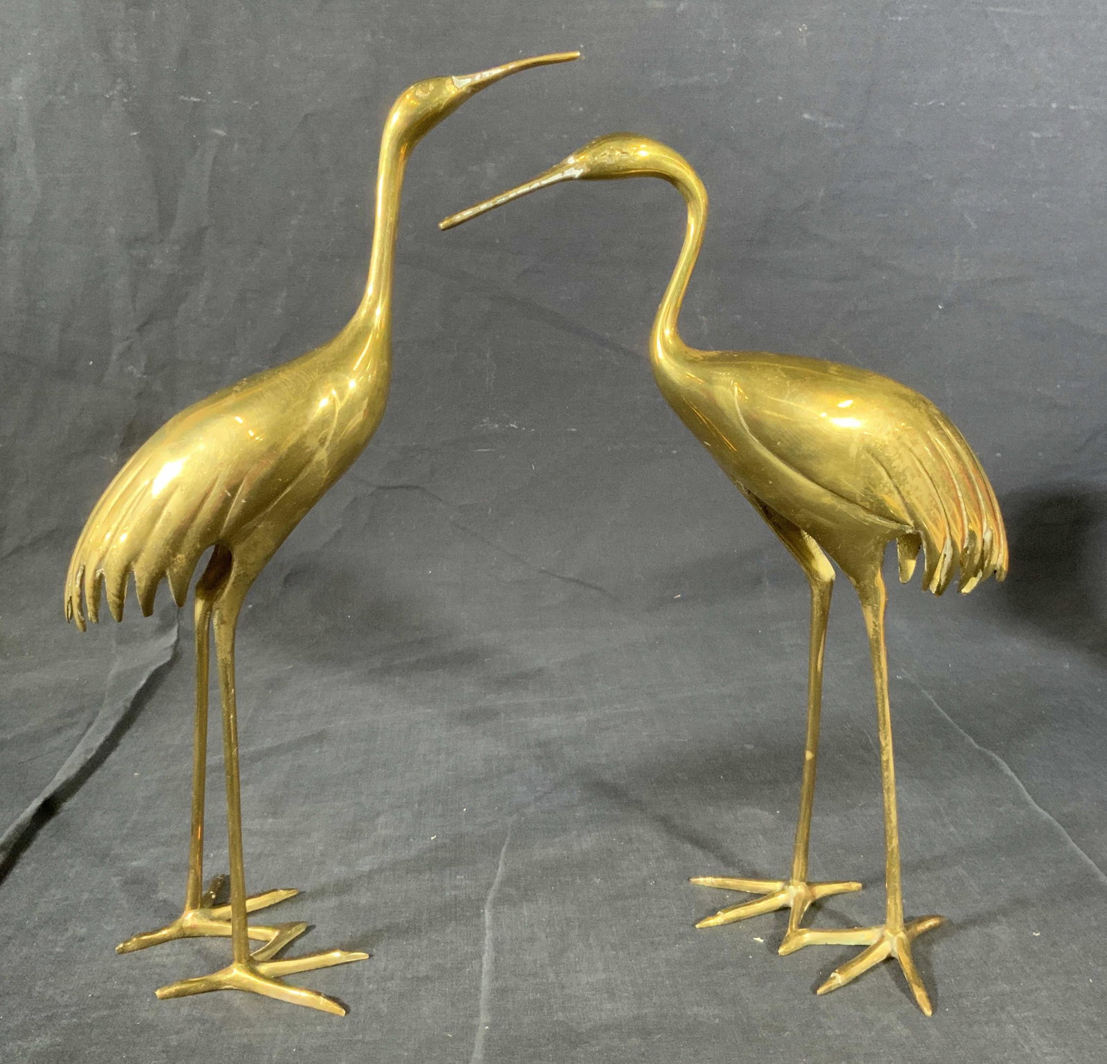 Pair Brass Crane Figural Sculptures: Pair Brass Crane Sculptures, no apparent inscriptions or marks, shorter crane measures 11 1/4 x 7 3/4 inches at widest point, taller crane measures 11 7/8 inches tall x 7 1/8 inches at widest point, s