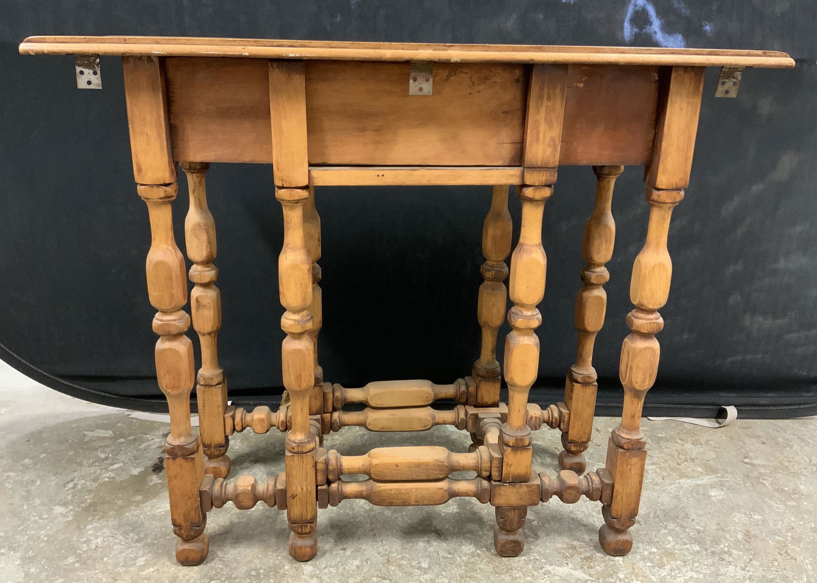 Vintage Wooden Hallway Table: Table, possibly antique, wooden table. Was originally crafted as a drop leaf table, leaves are absent and needs replacing. Measures approx 26.75 inches h x 36 inches w x 12.75 inches deep. Wear is con