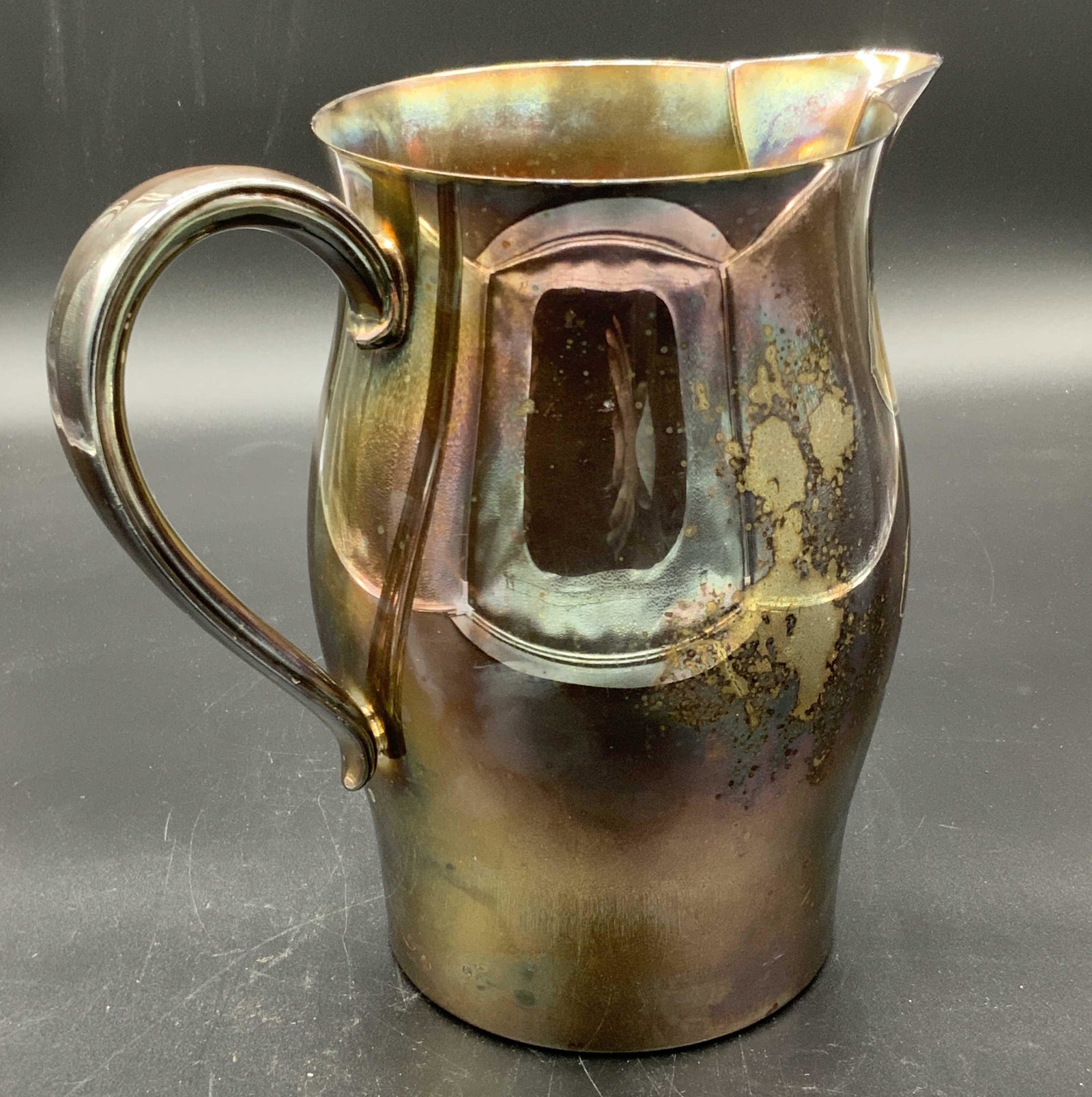 WM ROGERS Paul Revere Repo. Silver Plated Pitcher: A silver plated pitcher signed on the underside: WM ROGERS, PAUL REVERE REPRODUCTION. The piece is polished. Has one handle. Some wear to the silver plated metal. Approx. 7.5H x 7.5W in. Silver plated