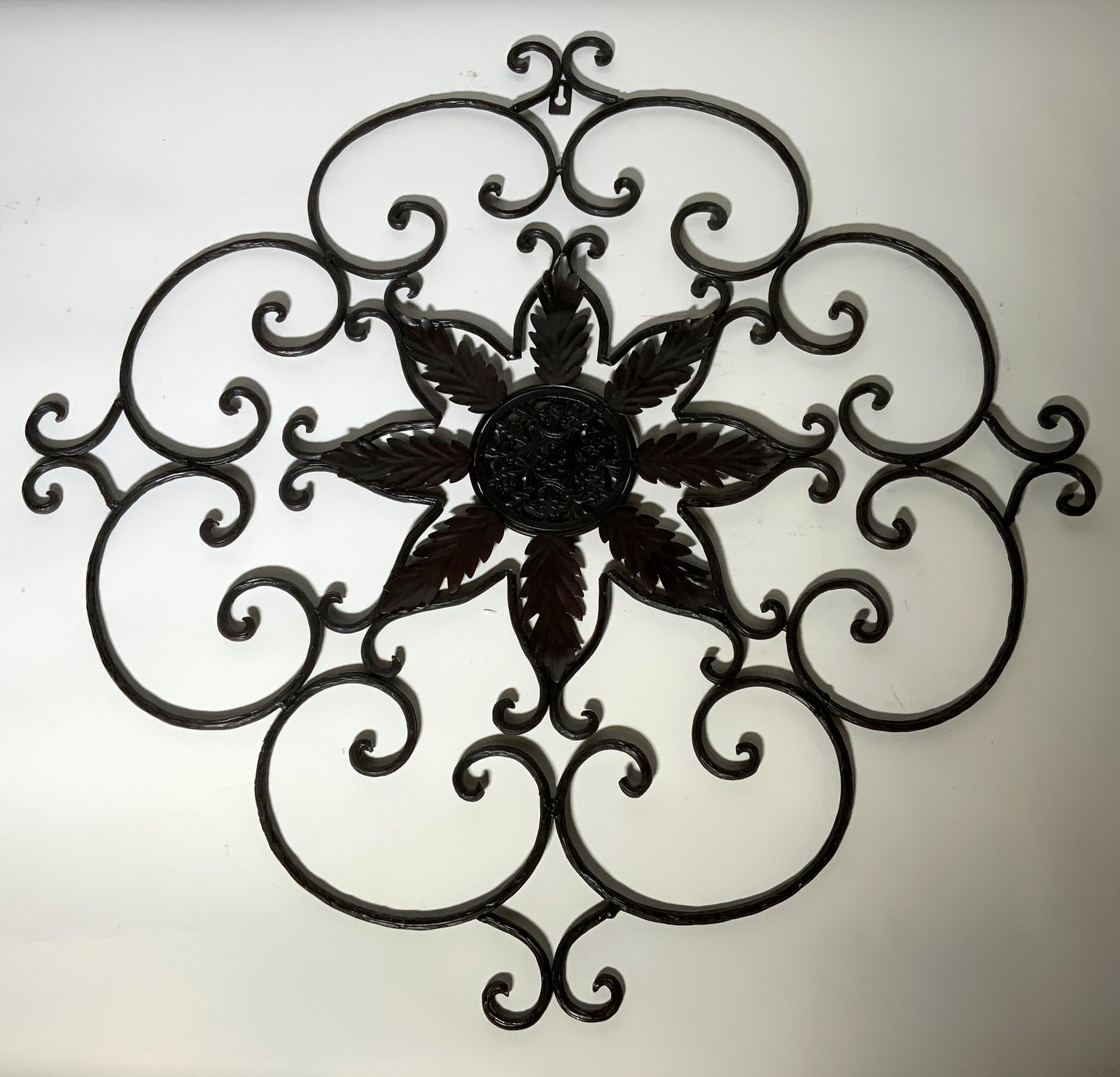 Iron Wall Decor with Floral Elements: Iron Wall Decor with Floral Elements, no apparent inscriptions or marks, measures 26 1/2 x 26 7/8 inches, some surface wear to piece, Wall decor, wall accessory, decorative accessory, iron, metalware,
