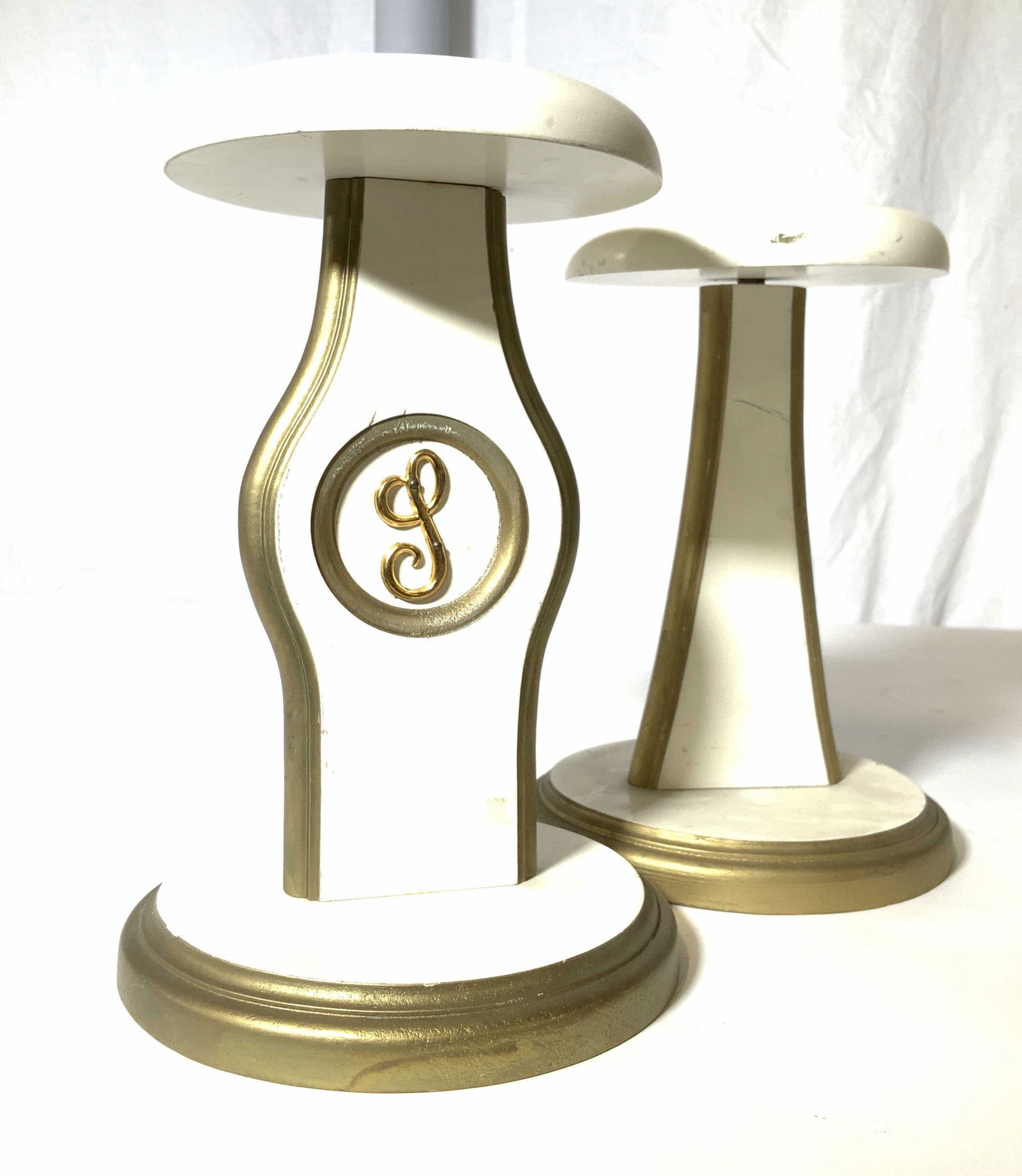 Pair Freestanding Hat and Wig Rack: Vintage Wood Racks , painted cream and gold, app 9 in. Ht, base 6.5 in. Wide. One with script letter L nailed to inner circle. Property of Manhattan Estate Wig stand, hat stand, vintage hat and wig ra