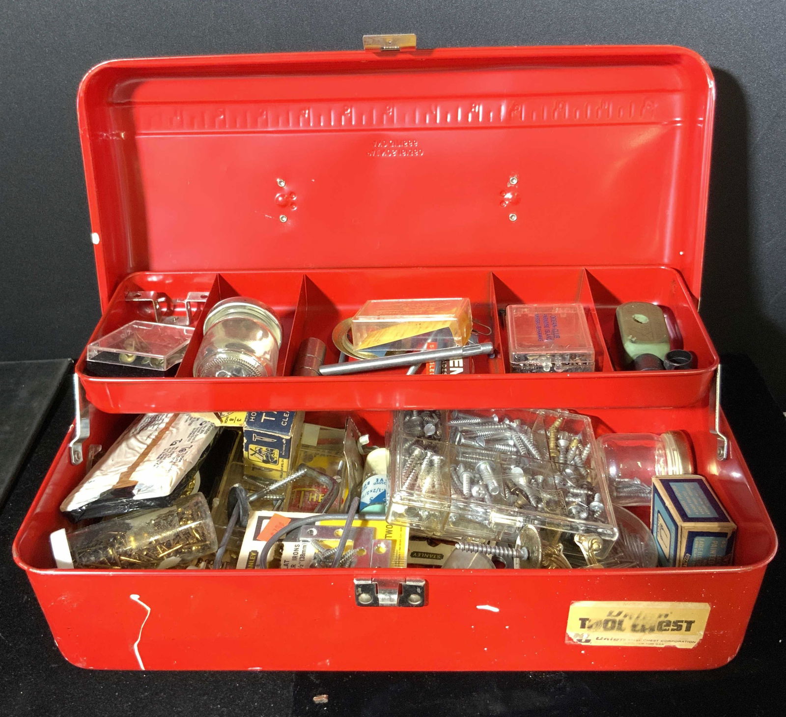 Vintage Red Metal UNION TOOL CHEST W/ Tools: A vintage red metal gadget / tool box with silver tone metal hardware. The handle is comprised of a white hued composite material. Interior is has two levels. Top has level has compartments. The stick