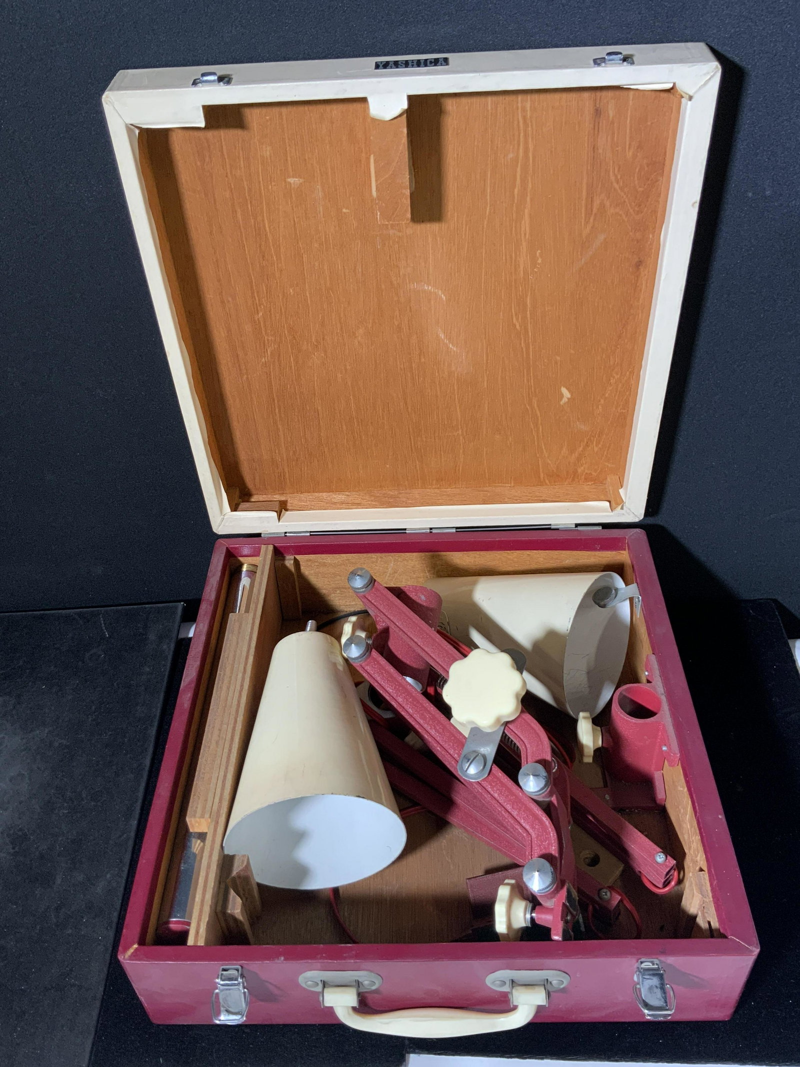 YASHICA COPYING STAND W/ Original Case: A YASHICA copying stand that comes in it’s original case. The instruction pamphlet comes with the piece. Wear, some rips, to pamphlet. Piece not assembled or tested for working condition. The pieces
