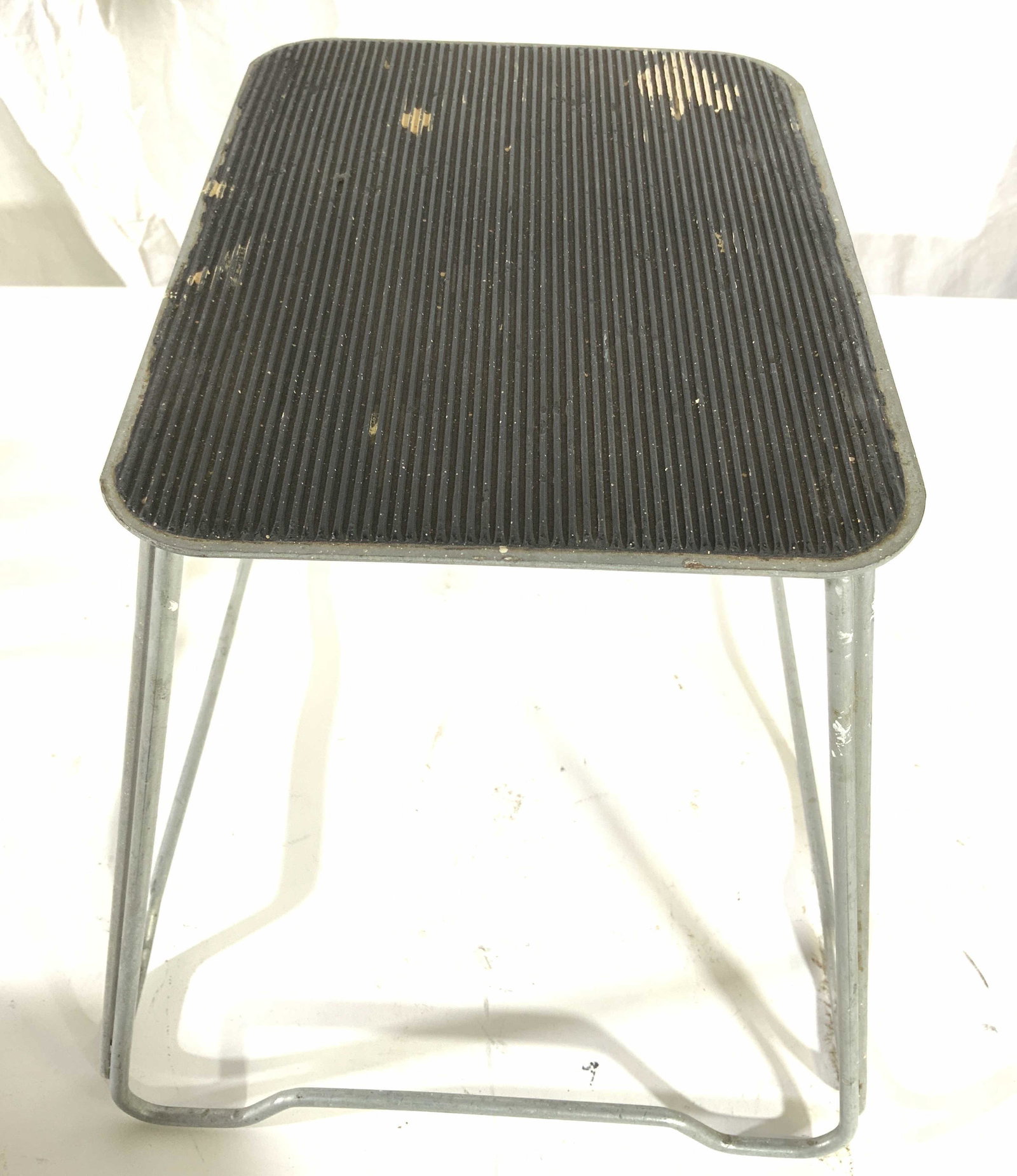 Vintage Metal Step Stool W Rubber Platform: Step stool is vintage and metal. Piece is slate toned. Top of piece is black toned & appears to be rubber. Piece measures approx 10 inches tall & deep 13 inches wide. Step stool, vintage step stool, m