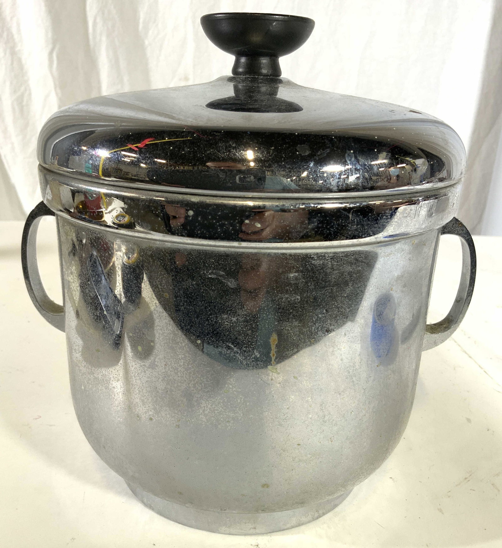 THE SHEFFIELD SILVER CO Ice Bucket W Lid: Underside of piece is marked THE SHEFFIELD SILVER CO. Ice bucket has 2 handles and lid with black toned handle. Piece measures approx 9 inches tall and wide. Ice bucket, ice bucket with handles, Sheff