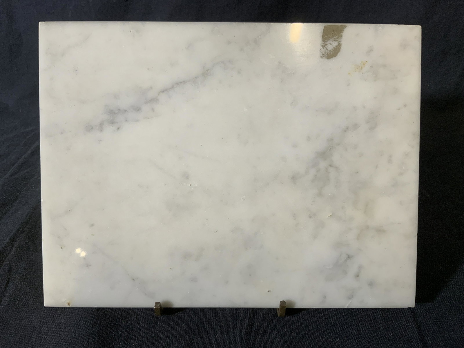 Brass Footed Marble Trivet: Marble trivet, possibly vintage, rests on four brass feet. Measures approx 1 inch h, and 8 inches W. Wear is consistent with age and use, some chipping to edges. kitchenalia, kitchen collectibles, ret