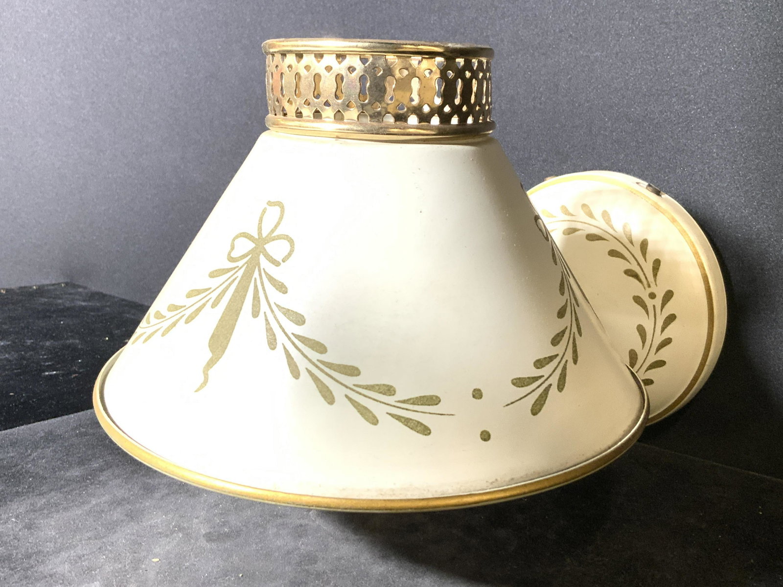 Vintage Toleware Wall Sconce W Shade: Wall sconce is vintage possibly antique. Piece has a cream slate toned shade & wall mount area with olive toned decorative detail. Toleware, Toleware wall sconce, Toleware sconce, vintage wall sconce,