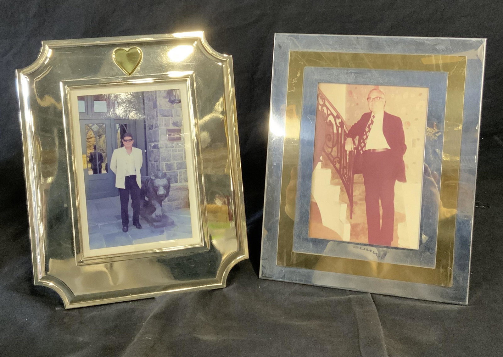 Group Lot 2 Metal Picture Frames: Group lot 2 Metal picture frames, one the two is all silver metal frame with a gold colored metal heart to the top of it, the other frame is silver and gold toned metal stripes, both measure approxima
