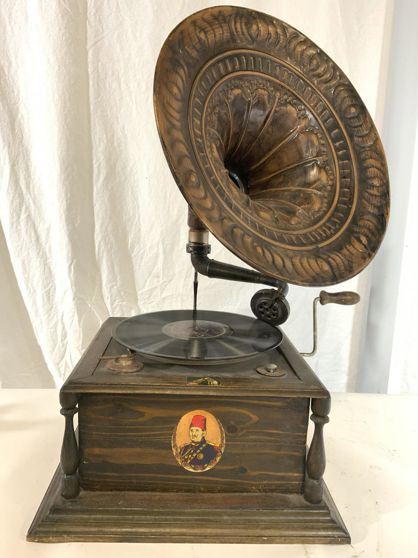 Vintage Wooden Victrola Phonograph: Phonograph is vintage & wooden. Piece has copper toned metal horn style structure right side of piece has crank. Piece measures approx 26 inches tall 15 inches wide. Phonograph, victrola, gramophone, 