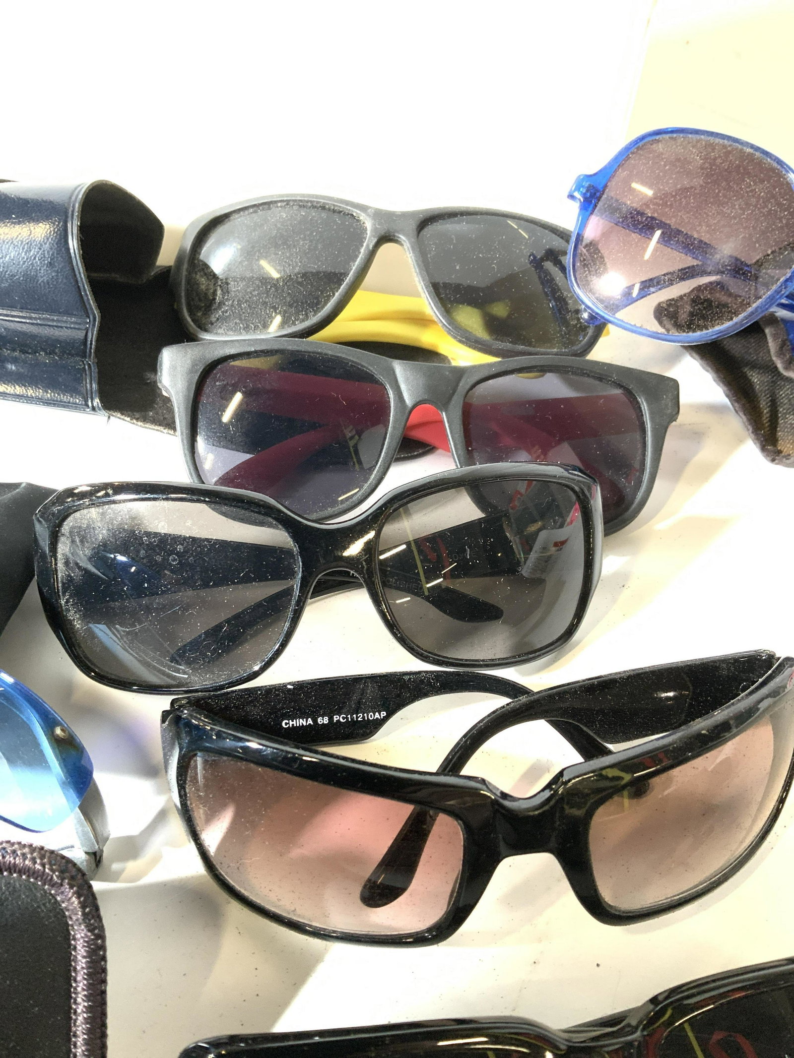 Lot 15 Fashion Sun Glasses and Cases: Various vintage sunglasses, c. 1980s frames, all but one have a case, sunglasses, blue frames, black frames, sporty frames, blue lenses. Vintage Sunglasses, Sunwear, Sun glass frames, vintage c. 1980s