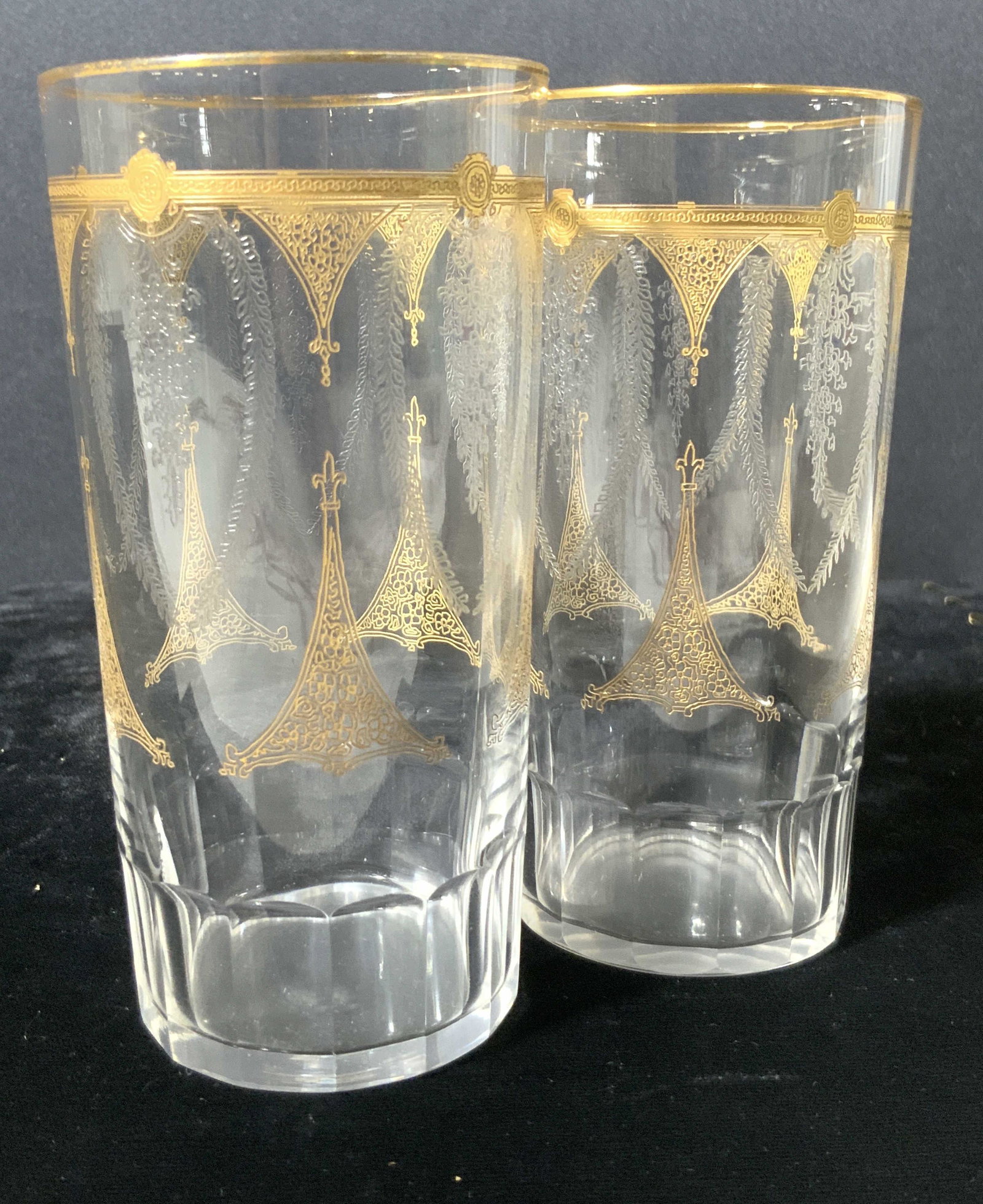 Pair Gilt Accented Etched Crystal Glasses: A pair of colorless glasses with etched designs and gilt accents. Approx. 5H x 2.5W in. Property of NYC Manhattan Estate. Crystal Glasses, glassware, tabletop accessories and decor, table setting, Bar