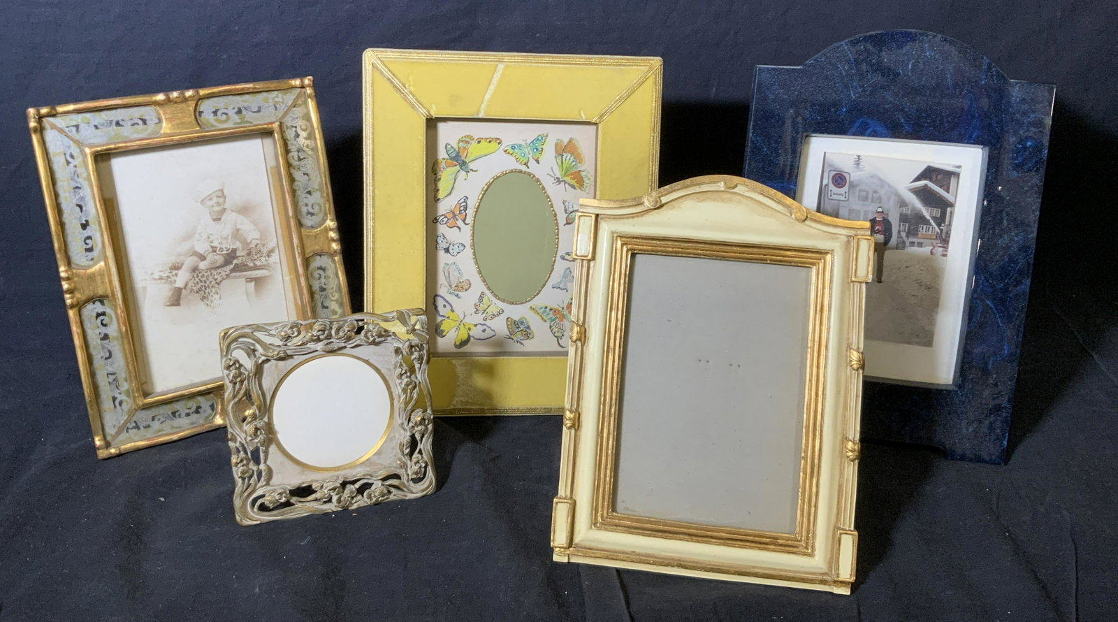 Group Lot 5 Picture Frames: Group lot 5 various picture frames, lot includes frames of wood metal composite and ceramic, all frames have some varying amount of wear or damage, largest of the frames measures 10.5 inches tall by 8