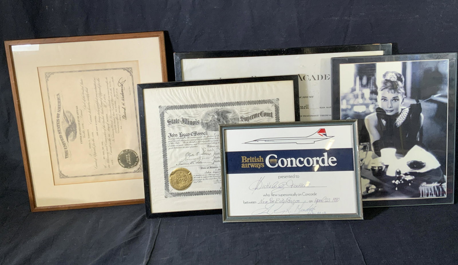Lot 5 Wooden & Composite Picture Frames: Five rectangular/ square form frames for housing pictures. Frames are primarily black and brown hues, one is gray toned hue. The frames are crafted from wood and composite material. Frames house an im