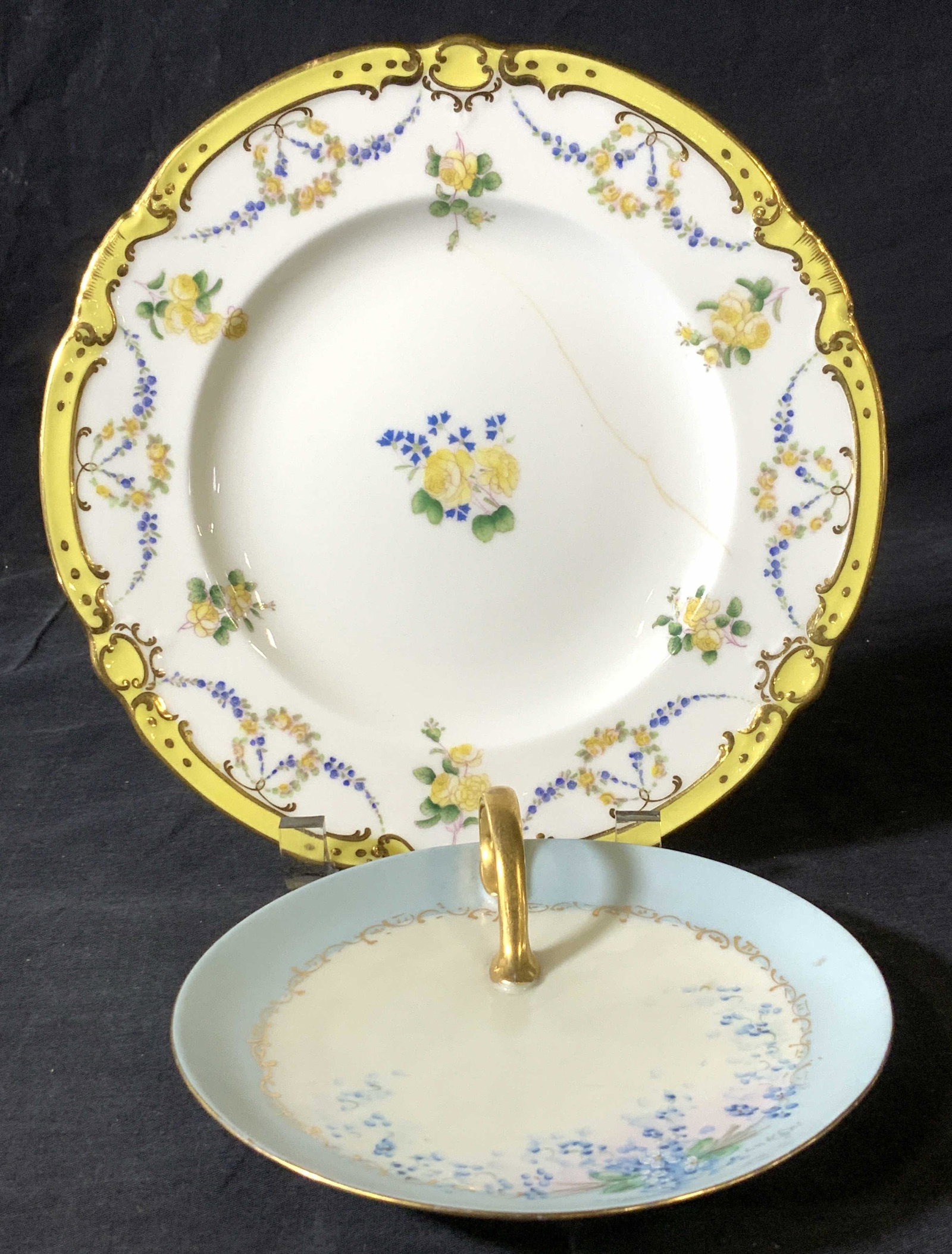 2 Porcelain Plates, MINTONS & MZ Austria: Hand painted vintage porcelain plates, both hallmarked. Yellow and gilt Rose MINTON PLATE , added plate numbers G7226 , fissure to glaze, 8.75 in. Gilt handle porcelain plate w/ blue border and floral