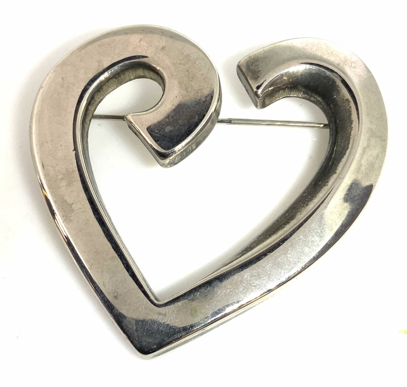 Lot 3 Black Bold and Silver Toned Jewelry: Large silver toned open form heart shape brooch, 2.25 x 2 in. Bold chunk black disc bead necklace with oversized silver toned orb of 1 in.- a definite choker necklace, 15 in. Twist clasp. Black seed -