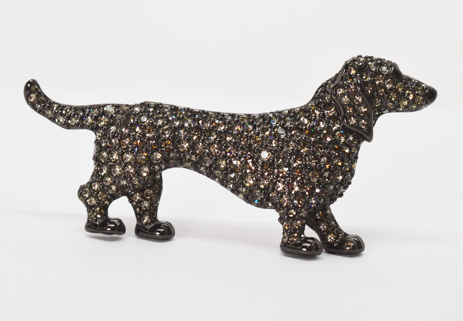 Swarovski Crystal Black Dachshund Enamel Brooch: Always have your best friend with you when wearing this adorable black enameled diamond crystal Swarovski Dachshund Brooch. A cheerful little piece with glittering pave crystals to create its sparklin