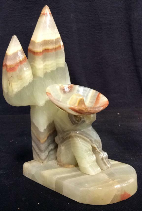 Onyx Man and Cactus Sculpted Bookend: Piece is onyx. Contains multi toned banded detail. Contains tones of orange, yellow, grey and light green. Measures approx 7 inches tall 4.5 inches deep 3 inches wide. Screws on underside need to be t