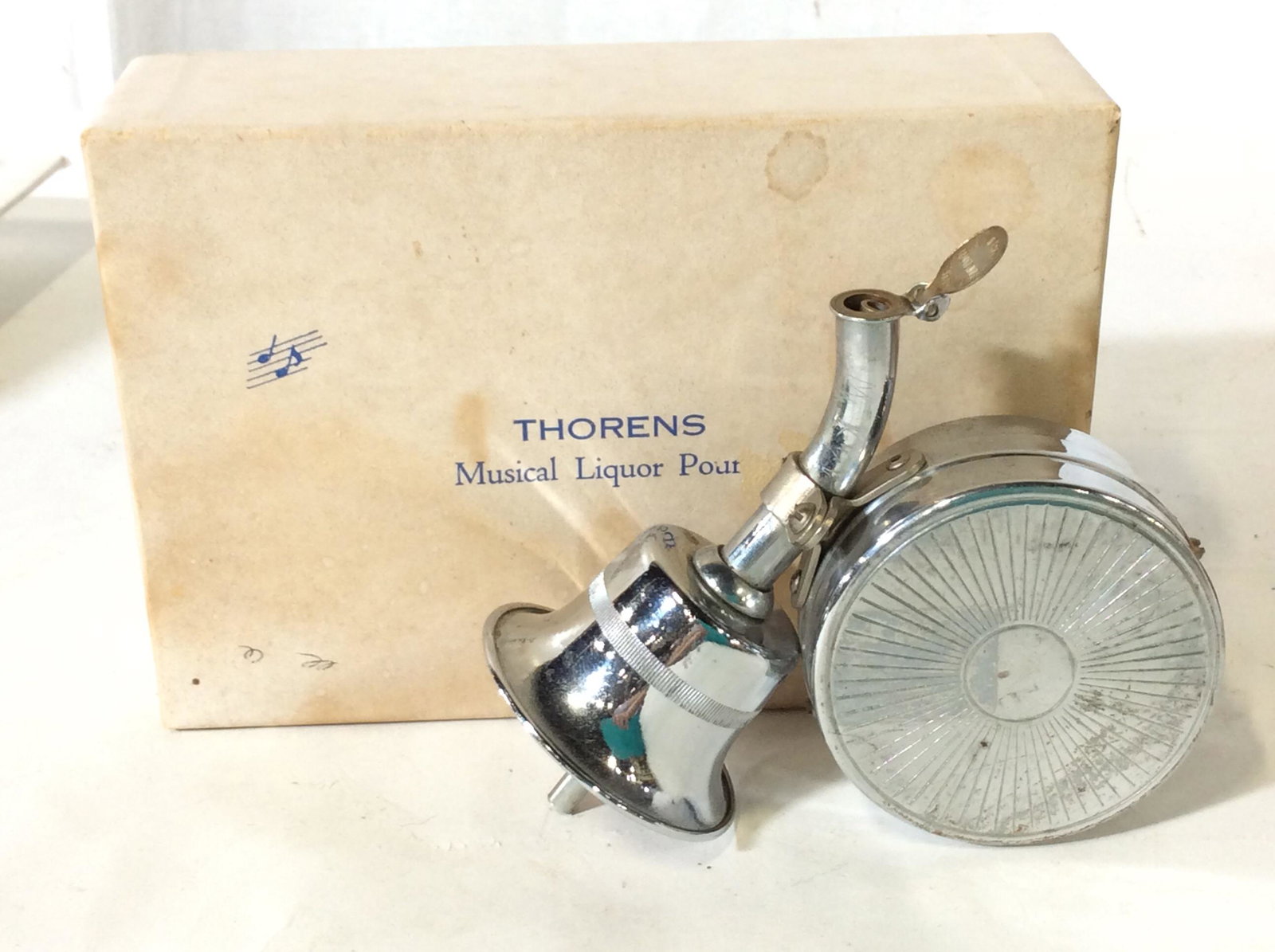 THORENS Musical Liquor Pout, Original Box: Silver toned ( Silverstein) , plays music, must twist a lot to wind, Original Box reads Thorens Musical Liquor pout, # LP 118 New Hyde Park, NY. Vintage Barware Pout, Musical Liquor Pout, Original Box