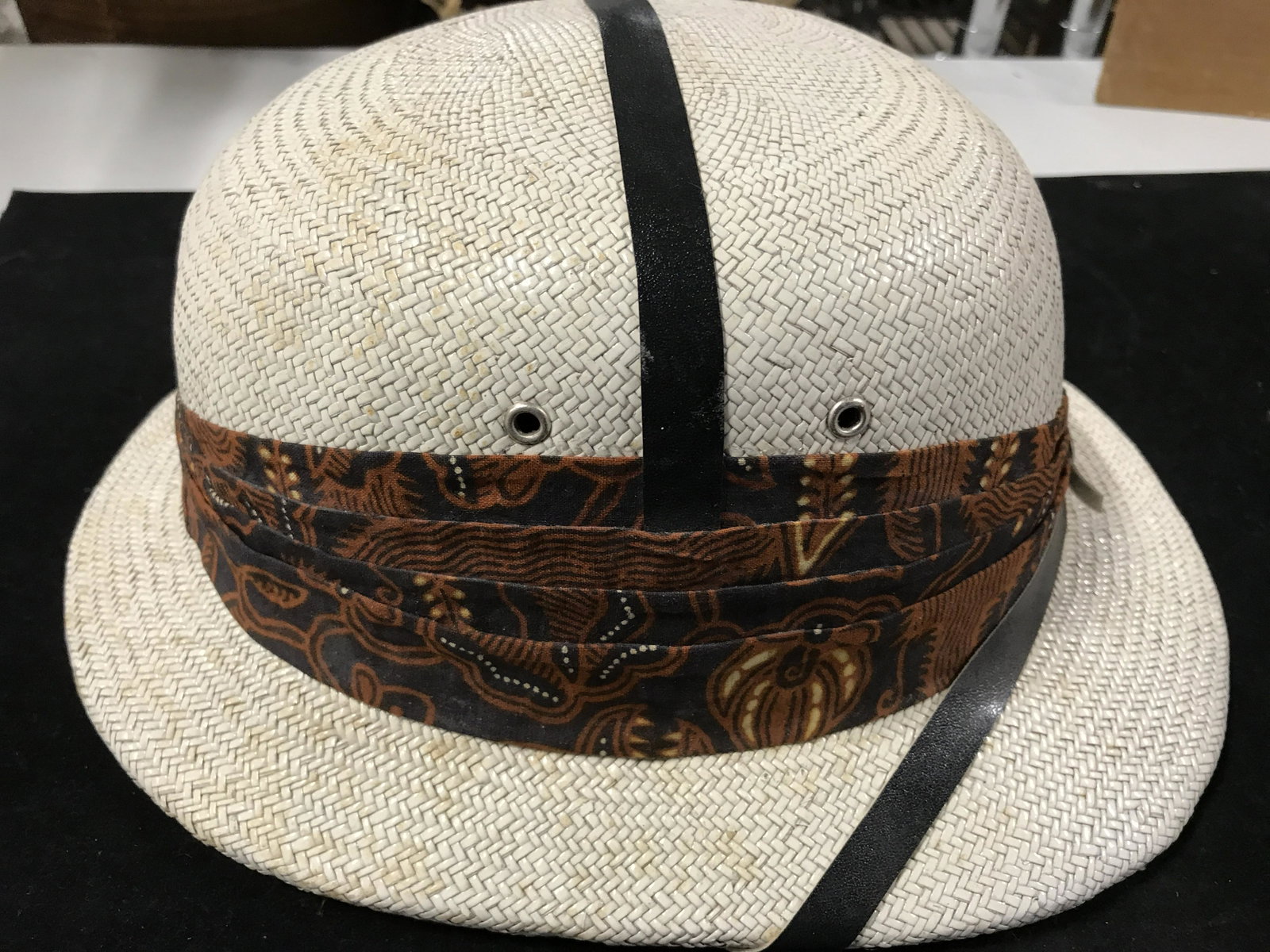 Vintage Hard Form Safari Hat: Size 8 hat. Decorative Scarf and leather features. Piece measures 14 x 10 in. Ht 5 in. Property of a New Canaan Connecticut Estate, home to Oil Executive and family who traveled and lived in the Far E