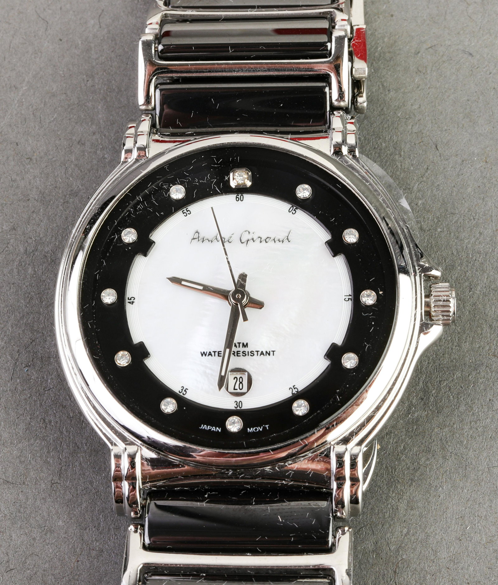 Andre Giroud Stainless Steel & MOP Dial Watch: Deep Blue "Master Diver" stainless steel Japan movement wristwatch with three hand movement and date set over mother-of-pearl dial, crystal markers, silver-tone bezel, signed on dial and case reverse,