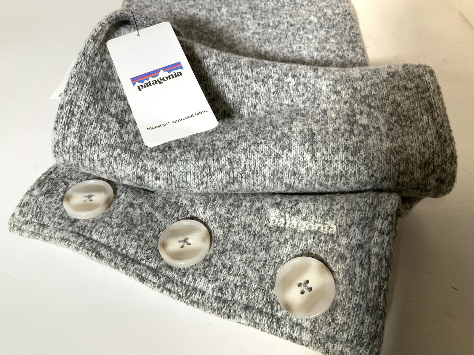 PATAGONIA Grey & White Plush Infinity Scarf: Made for Discovery Communications Store, this is a Patagonia, With Org Tag, poly knot scarf with 3 large buttons to create an extended long scarf or button up as an infinity scarf. Reads Women’s one
