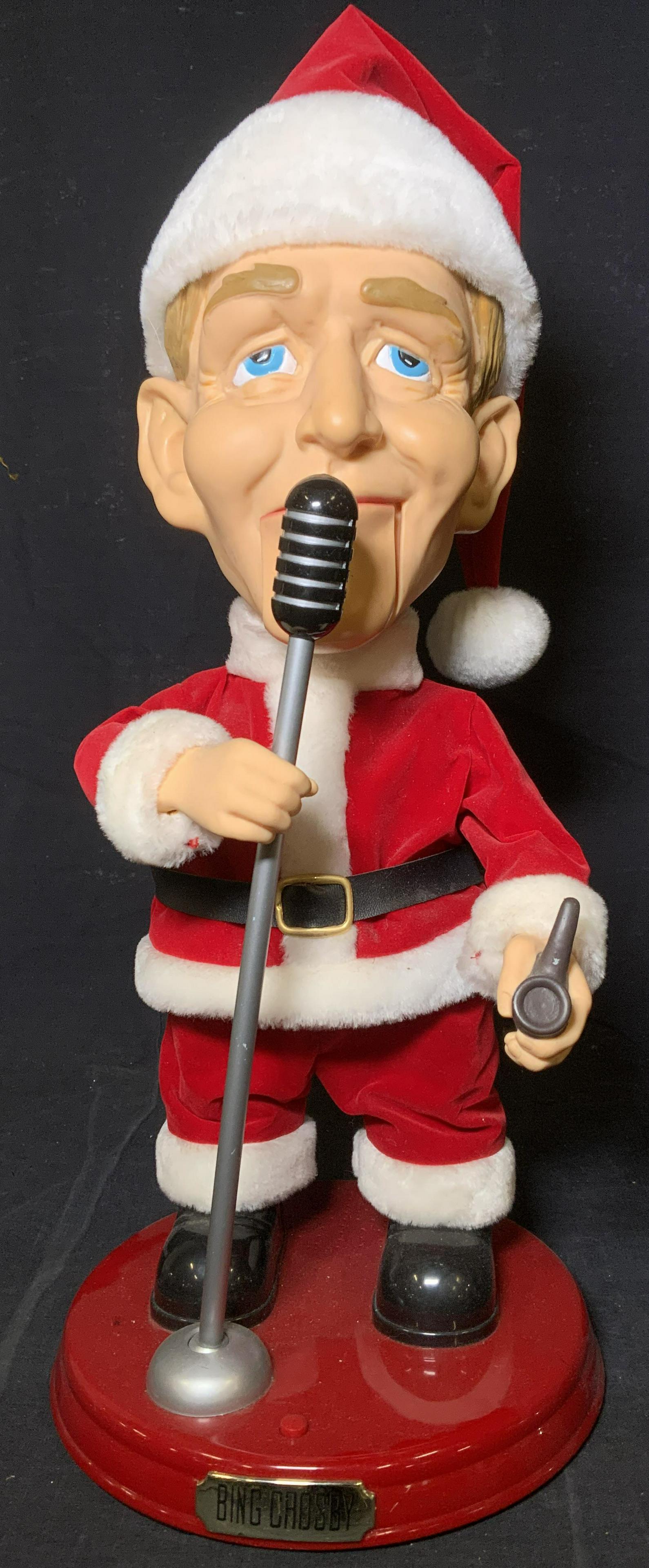 BING CROSBY Animatronic Christmas Figure: BING CROSBY animatronic figure. Figure is mounted to a plastic base, base reads as BING CROSBY. Depicts a stylized BING CROSBY holding a mic, and wearing a SANTA CLAUSE costume. Measures approx 19 inc