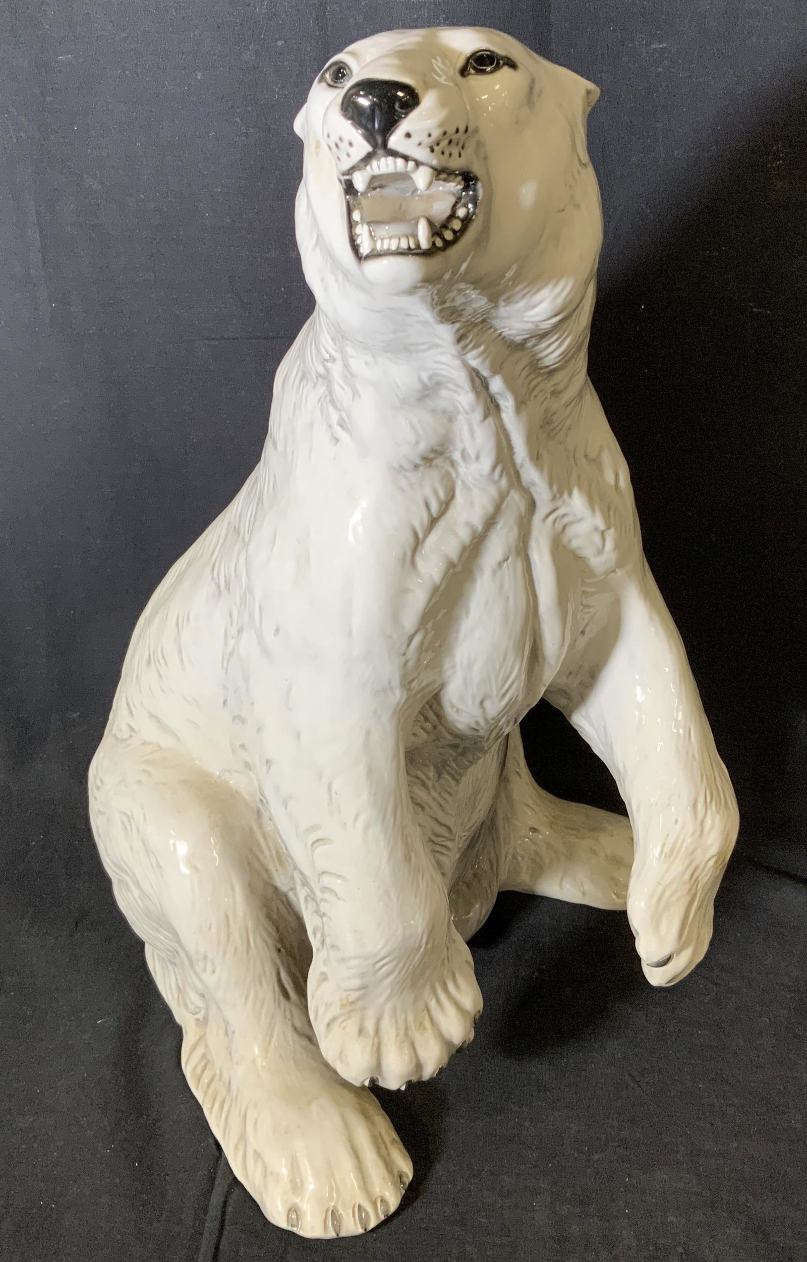 Ceramic Polar Bear Statue, 1982, Italy 19 in H: Ceramic Polar Bear Statue, 1982, Italy, inscription to base reads ‘Made in Italy 1982 9008’, subject a polar bear on its hind legs, measures 19 1/8 inches tall x 11 1/2 inches wide at base, some s