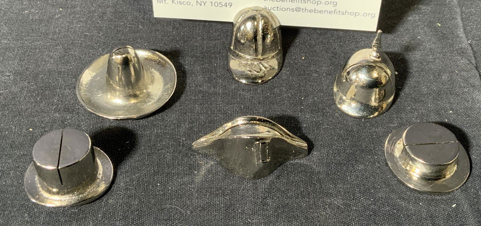 Collection of Hat Shaped Card Holders: Collection sod hat shaped card holders, label to box reads ‘Made in Italy’, lot consists of 6 different styles of hats made of metal with a small slit to the top of each for a card or label to be
