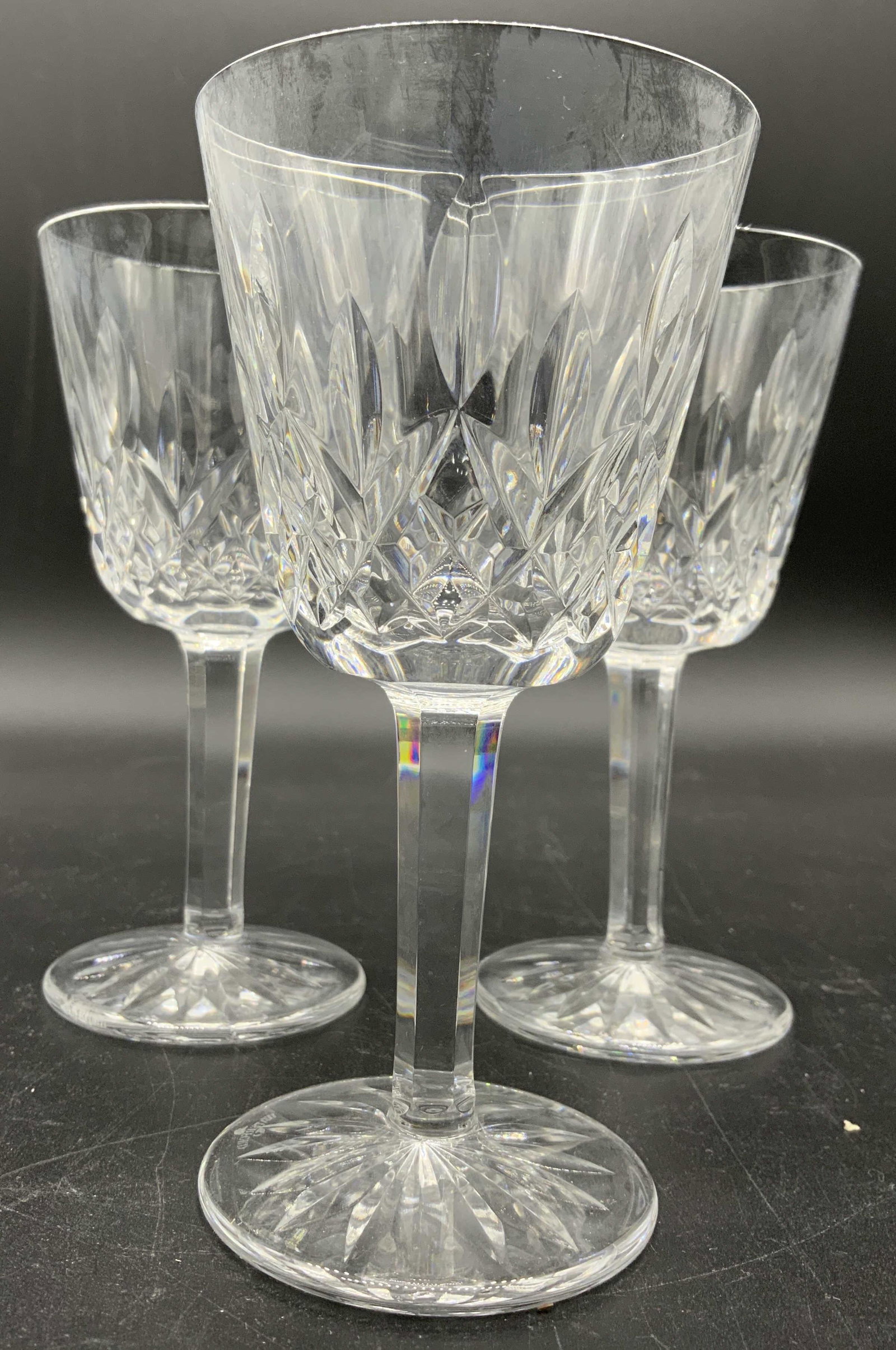 Set 4 WATERFORD Cut Crystal Stemware Goblets: Undersides of each goblet is marked WATERFORD. Lot includes 4 goblets. Each goblet is cut crystal. Each measures approx 8 inches tall 4.5 inches wide. Goblets, wine glasses, stemware, cut crystal, Wat