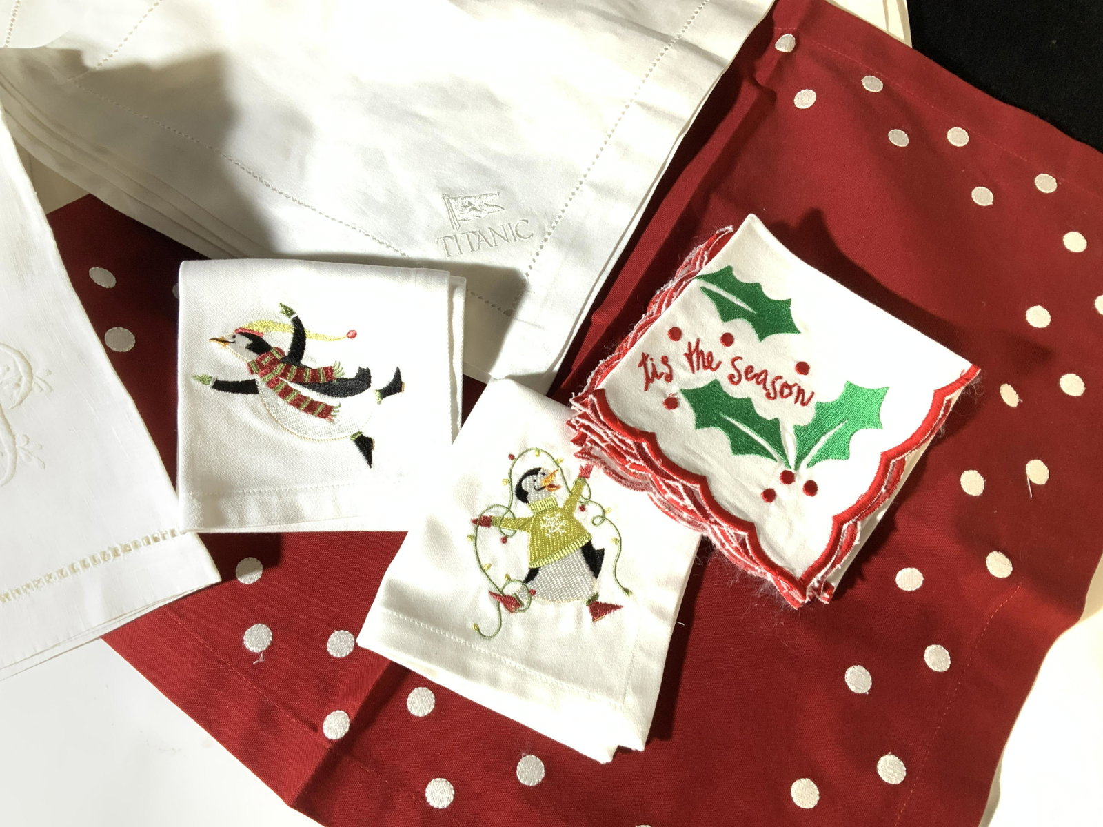 Multi Sets Christmas Napery &=Linen Placemats: Set 12 embroidered DANCING PENGUIN Cotton napkins for Christmastime. Silly penguins dressed up in holiday cheer, machine embroidered on corner of cloth napkin, crisp white, 9.5x 9.5 in. Some never use