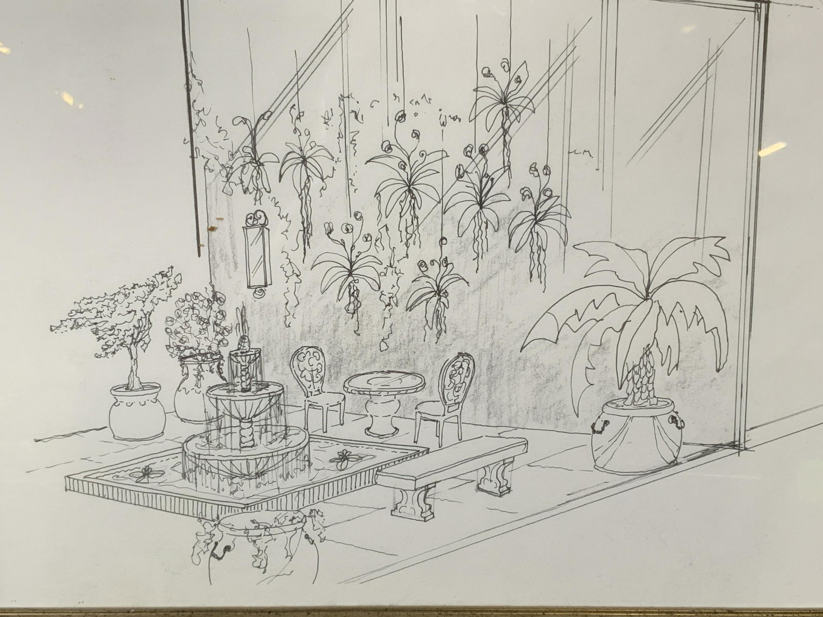 Lithograph of Courtyard in Black & White: Lithograph of courtyard in black and white, no apparent signatures or stamps, subject a courtyard with fountain and a variety of plants in pots, black and gold wooden frame, measures 12.25 inches tall