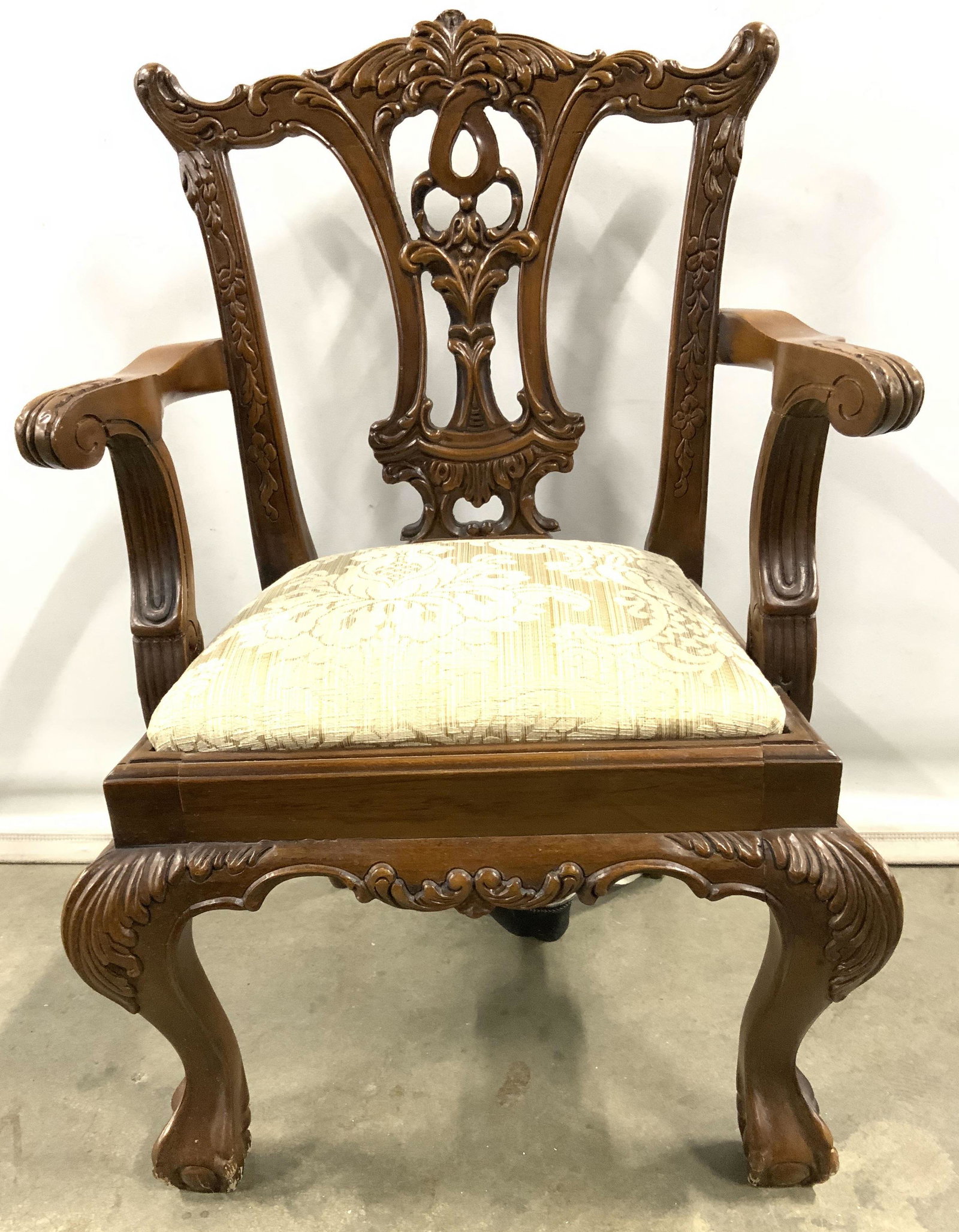 Vintage Carved Wooden Victorian Children’s Chair: Chair is vintage possibly antique. Piece has intricately carved wooden detail including ball & claw feet, leaf, c and s scoll detail. Chair upholstery is gold toned with ornate detailing. Piece measur