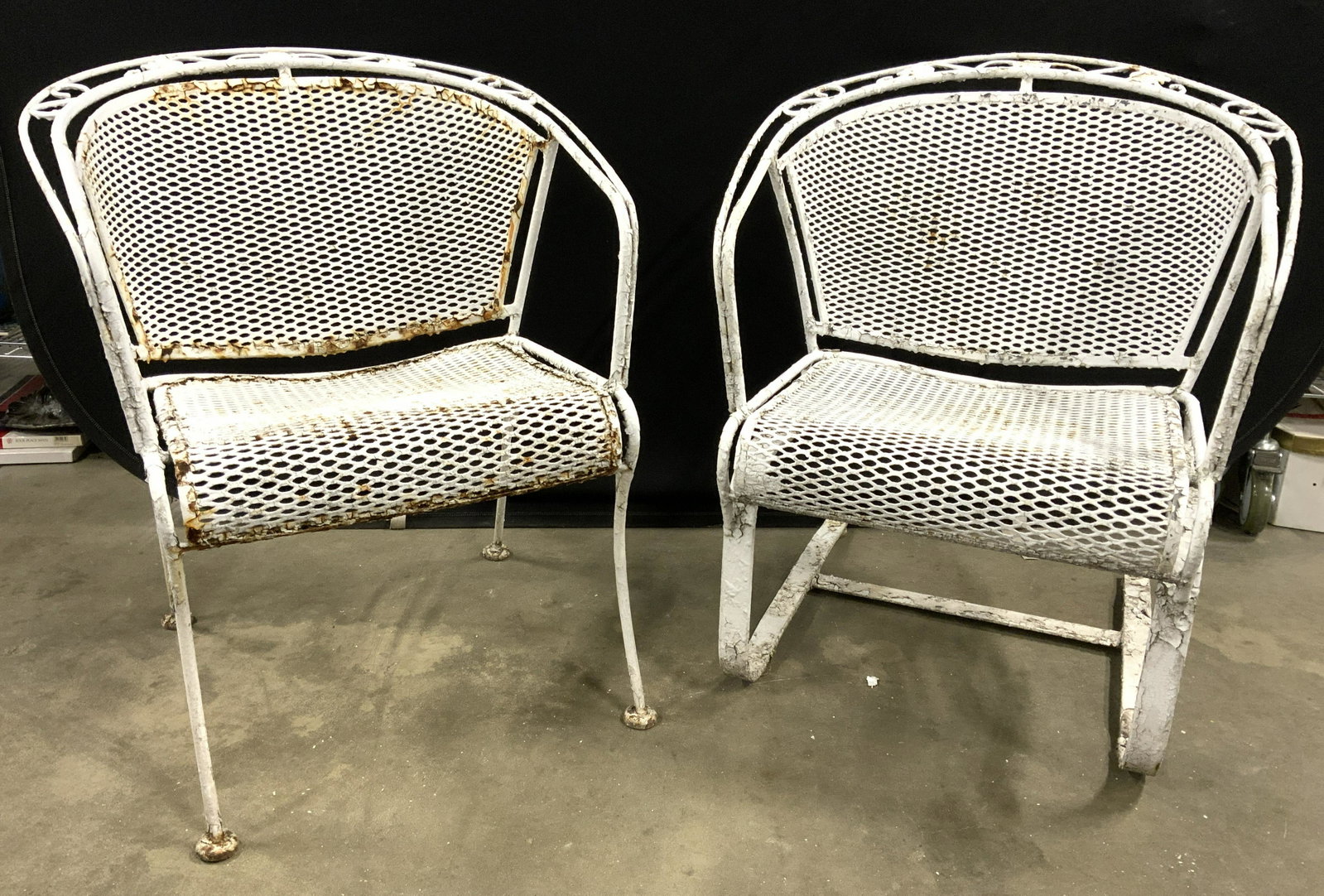 Lot 2 Vintage Iron Outdoor Patio Armchairs: Lot includes 2 outdoor chairs. Each are vintage possibly antique. Chairs are white toned & appear to possibly be iron. One chair has legs the other has cantilever build. Backrests are barrel shaped. T