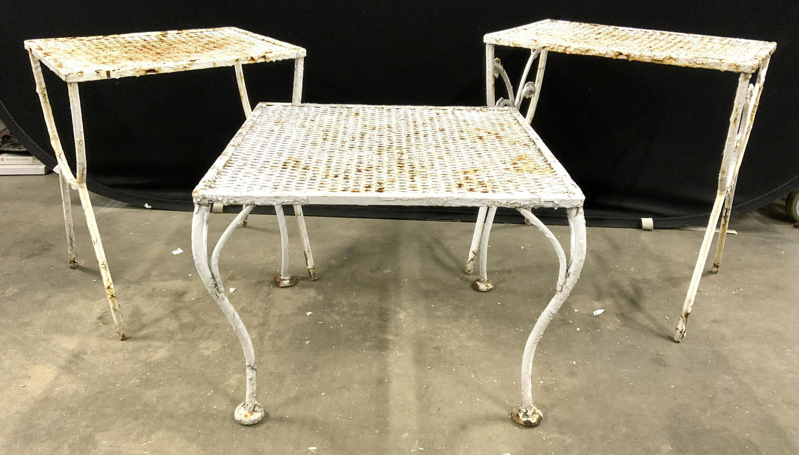 Lot 3 Vintage Iron Outdoor Side Tables: Side tables are vintage possibly antique. Each piece is white toned possibly iron. Each piece has 4 legs. Tallest table has vine & leaf structures. Tallest table measures approx 20 inches tall 19 inch