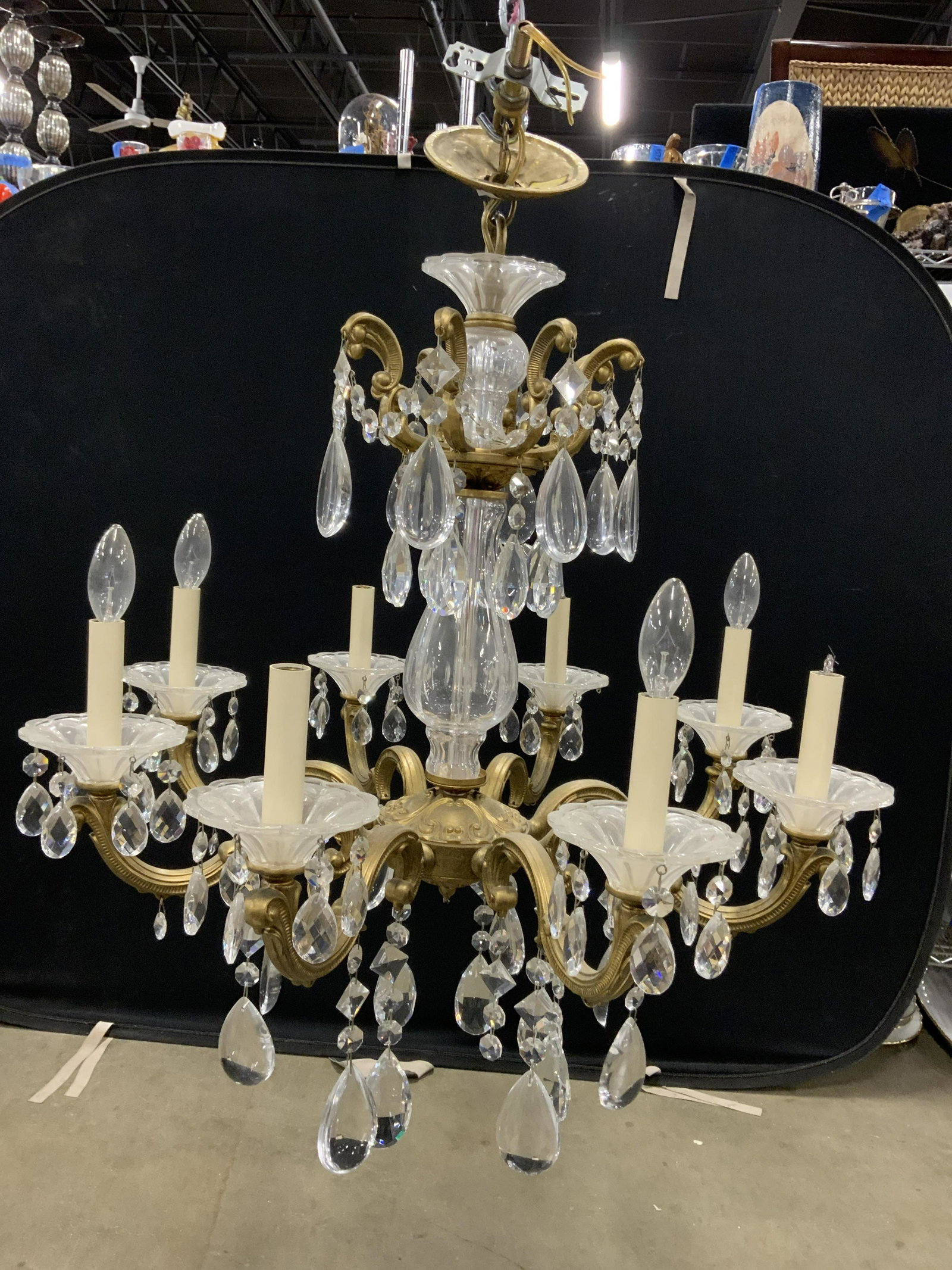 Vintage 8 Arm Crystal Chandelier W Shades, Prisms: Chandelier is vintage possibly antique. Piece has an assortment of variously shaped ornaments. Piece has 8 arms each with candlestick style bulb sockets. Chandelier Measures approximately 32 inches ta