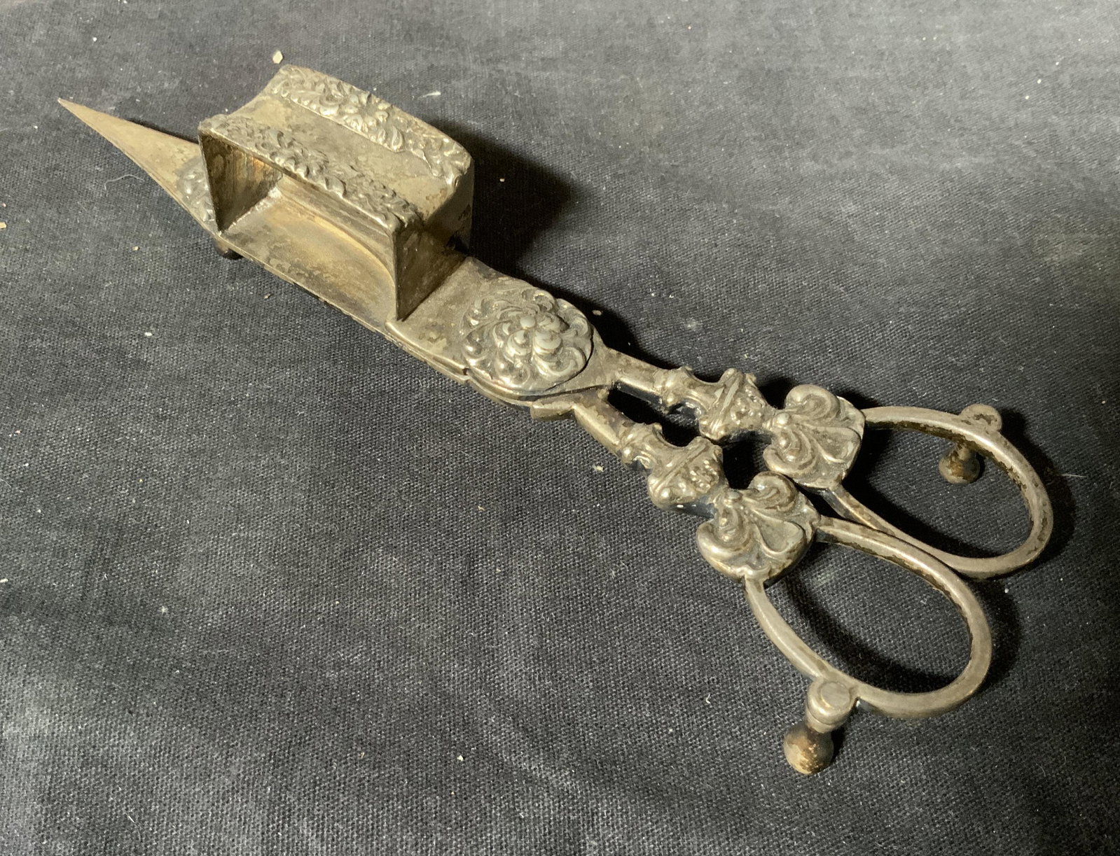 Vintage Metal Wick Scissors: Vintage possibly antique metal wick scissors, no apparent inscriptions or markings, subject an ornately cast pair of metal wick scissors, measures 7.25 inches long, tarnish and scuffs visible, This it