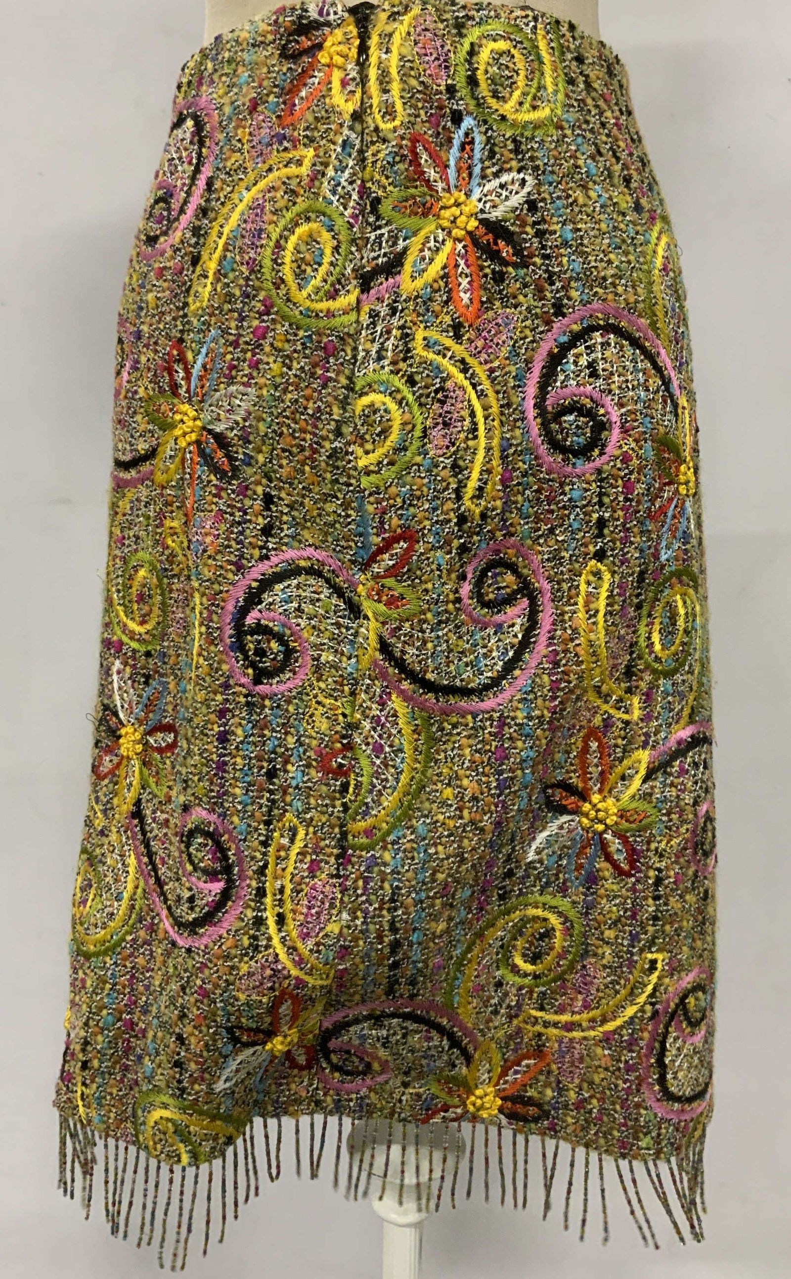 JOY PHILBIN RENA LANGE Embroidered Fringe Skirt: JOY PHILBIN RENA LANGE Embroidered Fringe Skirt, labels read ‘Rena Lange US 4’, a bright multicolored tweed skirt with beaded fringe and embroidered flowers, some loose threads, This item was gene