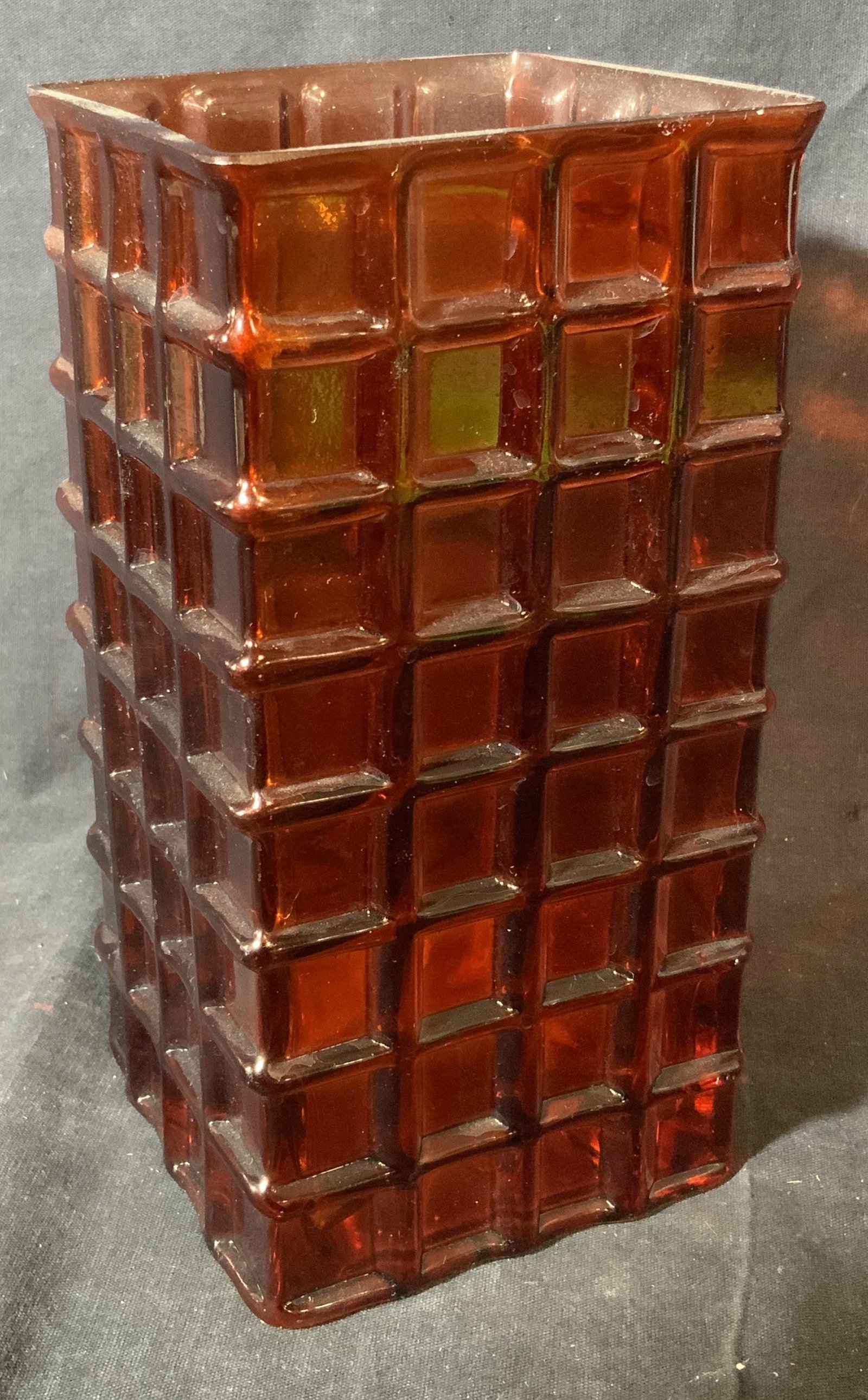 Brown Art Glass Rectangular Vase: Brown Art glass rectangular vase, no apparent inscriptions or markings, exterior decorated in a geometric grid pattern, piece measures 7.75 inches at tallest, rim measures as a 4 inch square, some wea