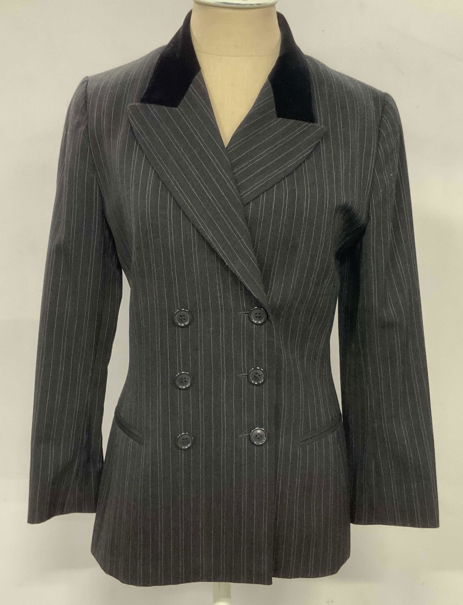 JOY PHILBIN Wool Blend Striped French Blazer: A black and gray hued button-up blazer once owned by Joy Philbin. The piece is crafted from a wool blend. Six buttons are present on the front facing side if the blazer as well as two exterior mock po