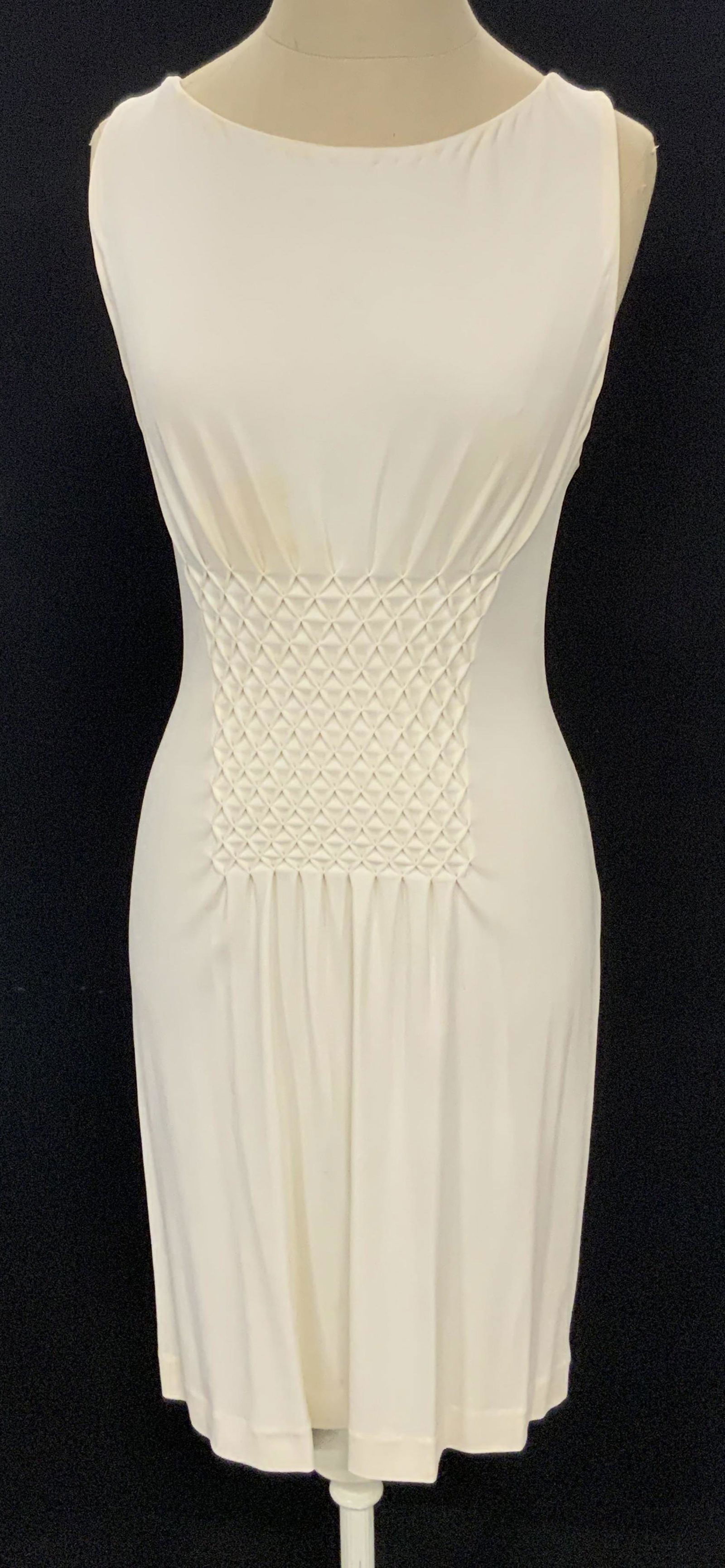 JOY PHILBIN Guy Laroche Designer Dress, Paris: A cap sleeve white hued dress with a textured fabric center. Piece once owned by Joy Philbin. Secures with a white hued zippered closure on the reverse. Comprised of a soft hand fabric. Piece has some