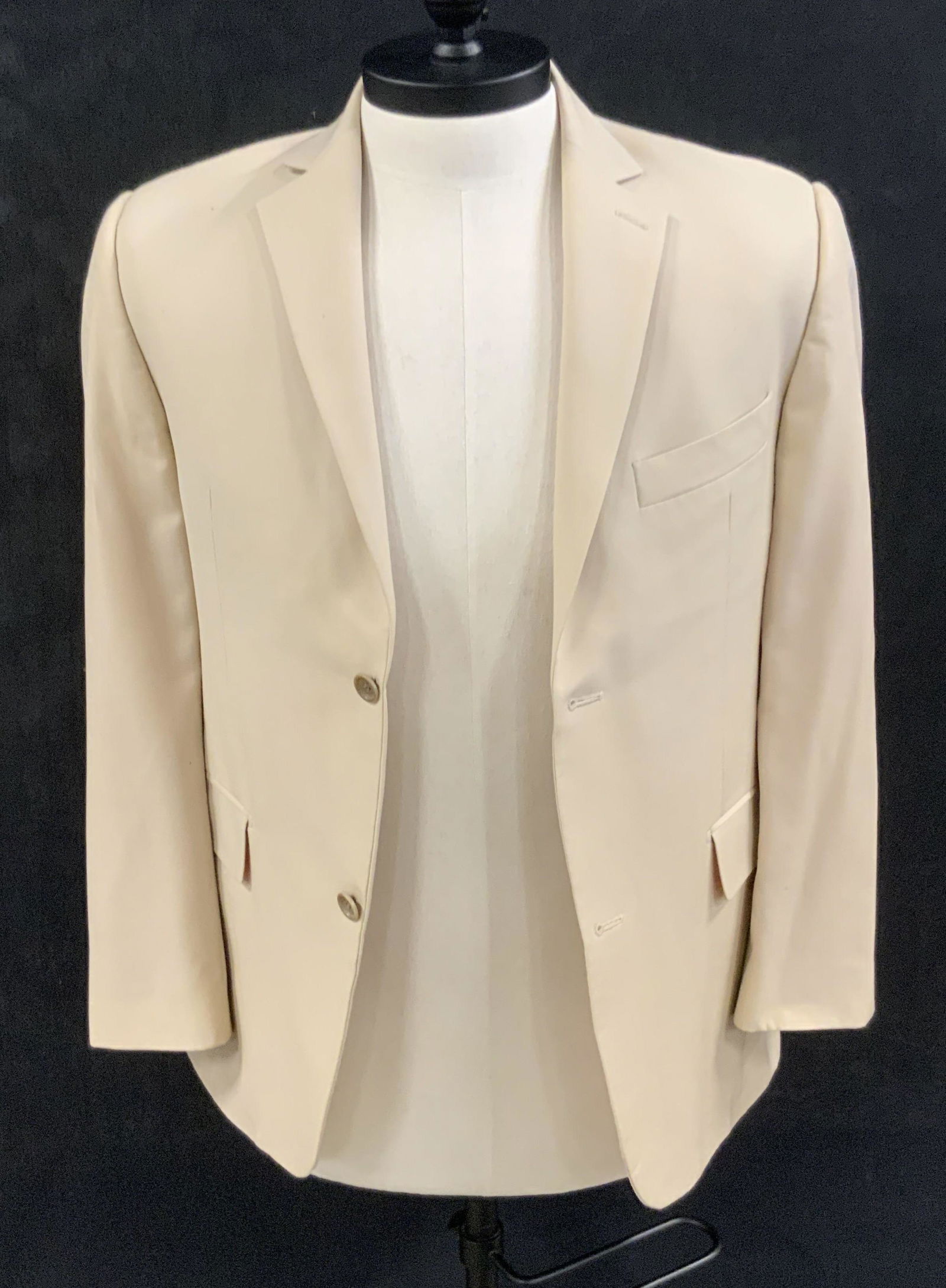 REGIS PHILBIN Guy Laroche Italian Wool Blazer: A light neutral toned blazer once worn by Regis Philbin. Piece has three exterior pockets and secures with brown hued buttons. Interior tags read GUY LAROCHE, MADE IN ITALY, SUPER 130 WOOL, ITALIAN FI