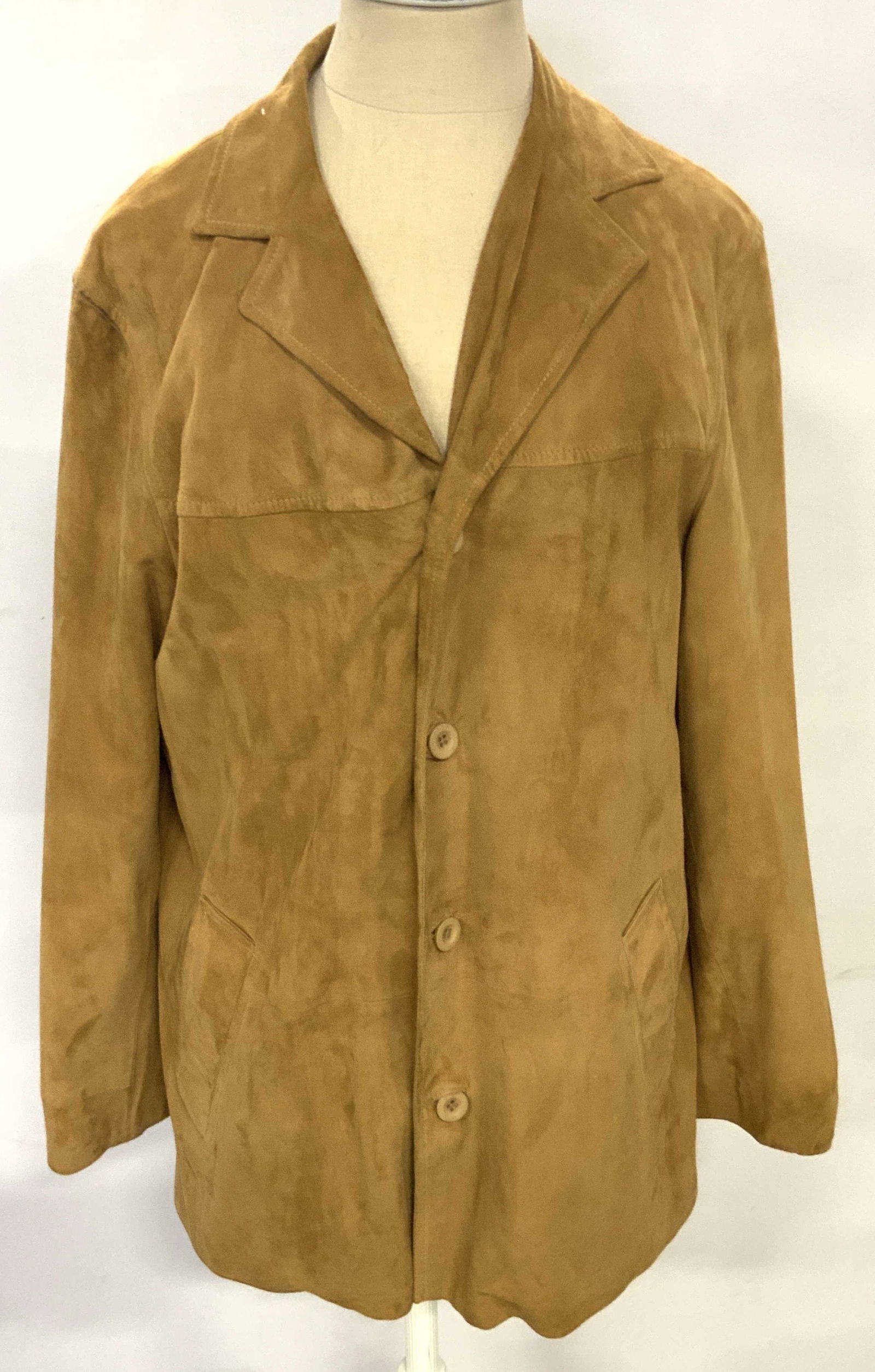 JOY PHILBIN GORDAN Rush Italian Leather Jacket: A brown leather jacket once owned by Joy Philbin. Two exterior pockets. Two interior zipper pocket. Piece secures brown hued buttons. Interior tags read GORDAN RUSH, MADE IN ITALY, M. Size Medium. Int