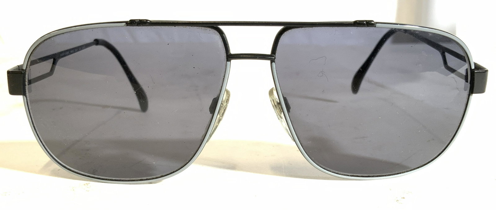 LUXOTTICA Pair Of Shades Sunglasses: Piece is marked LUXOTTICA 1265 MADE IN ITALY. Sunglasses are black & grey toned. This item was generously donated by Regis Philbin’s family and was the property of their Greenwich Connecticut Estate