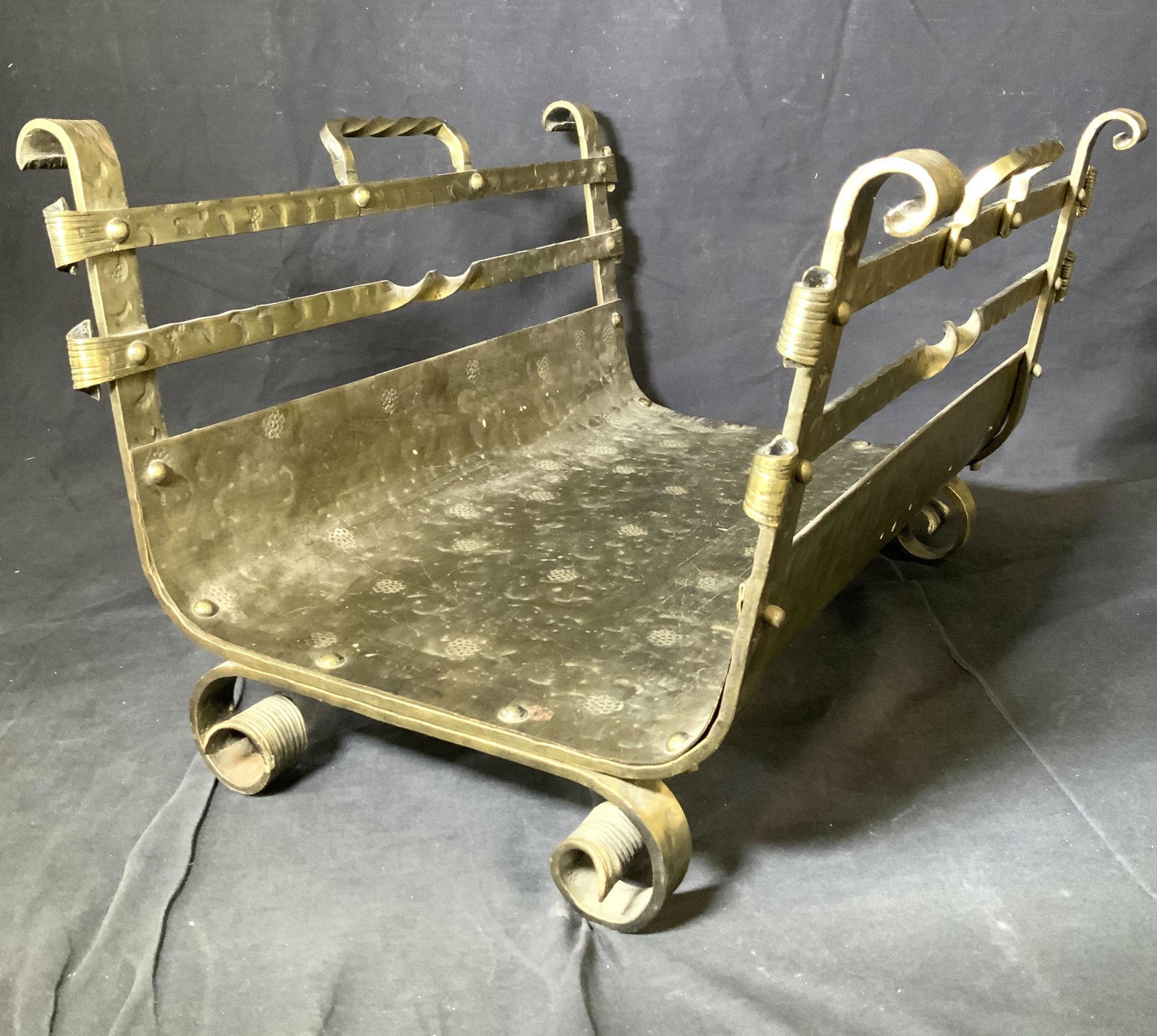 Oversized Bronze Firewood Log Holder: Vintage bronze vessel, used to hold firewood, upcycle magazine / newspaper holder, solid bronze bottom curving upward, with bronze bar sides and twisted bronze handles. Hammered metal adds regal appea
