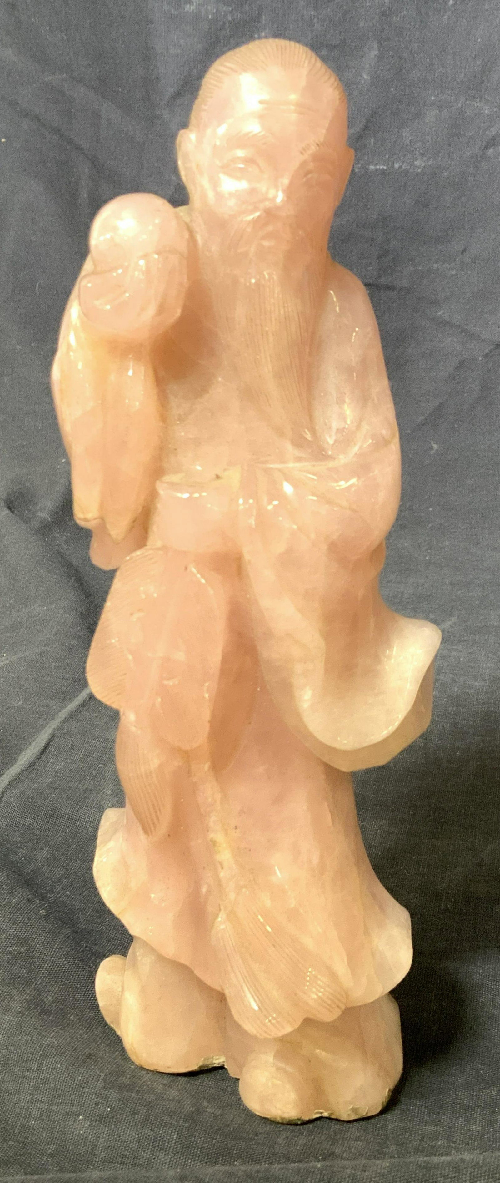 Pink Jade Statue, Man Holding Paintbrush and Orb: Carved of solid pink Jade, tests positive for Jade on gem tester. Man with long beard, delicately etched into stone, wearing robe and holding paint brush and palate in one hand and cupping an orb in t