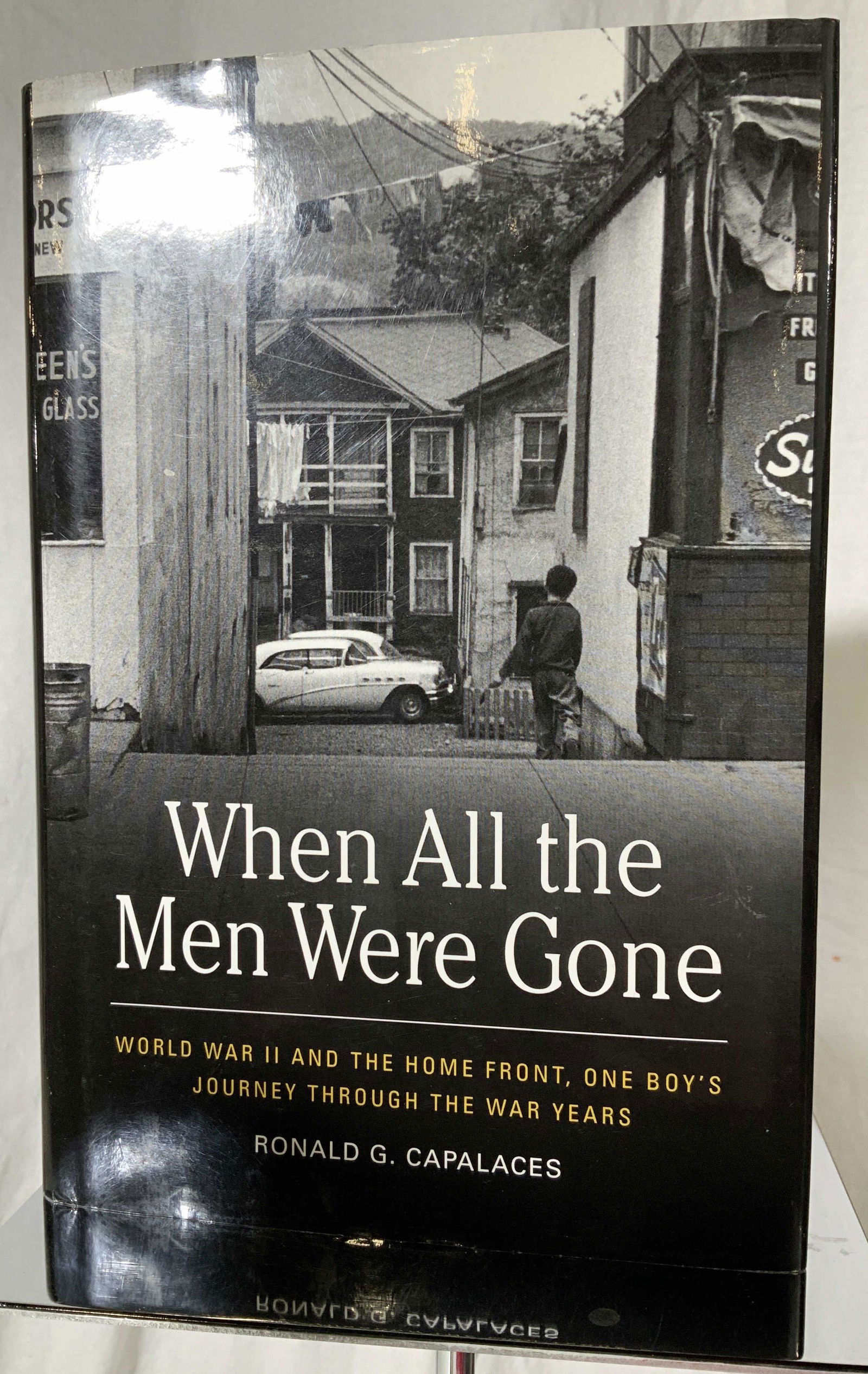 Signed R. Capalaces to Regis and Joy Philbin Book: Novel, WHEN ALL THE MEN WERE GONE- WWII AND THE HOME FRONT, One Boy’s Journey Through The War Years, author Ronald G. Capalaces SIGNED TO Regis and Joy Philbin. A memoir of five years of life growin
