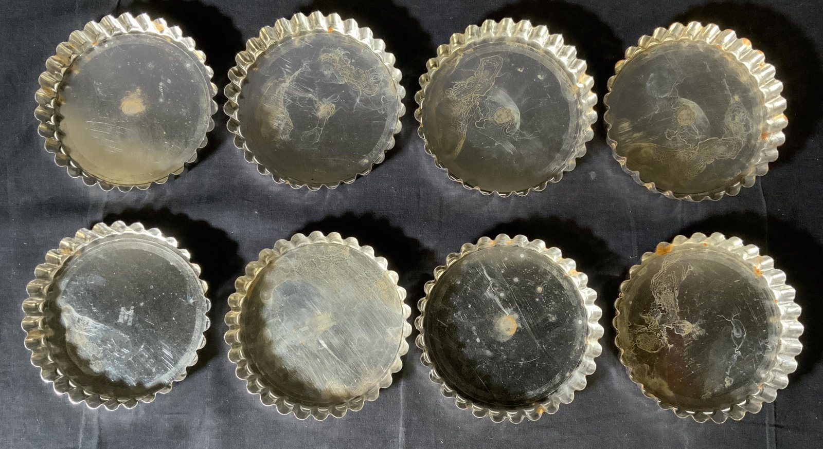 Set 8 Tart Tins, France: Set 8 Tart Tins, France, inscriptions read ‘Made in France’, tins have removable bases, all measure 4 3/4 inches in diameter, rust and surface wear, to pieces, Tart tin, tart pan, quiche dish, bak