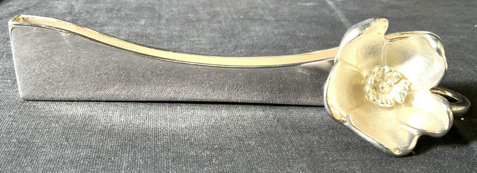 CHRISTOFLE Sterling Floral Document Holder: Backside of document holder is marked CHRISTOFLE. Piece appears to possibly be Sterling silver. Piece weighs approximately 4.62 Troy Ounces. Piece measures approx 6 inches long 1.25 inches tall & deep